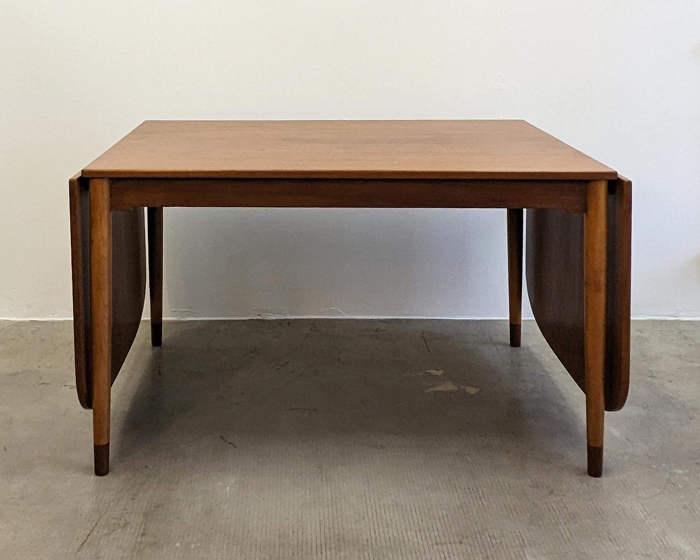 Børge Mogensen, Denmark (designer)

Dining table, c. 1960
Manufactured by Søborg Møbelfabrik, Denmark.

Teak with brass fittings.
Two end-hung leaves that can be independently raised, and can also be removed to store.

Beautiful condition. The table
