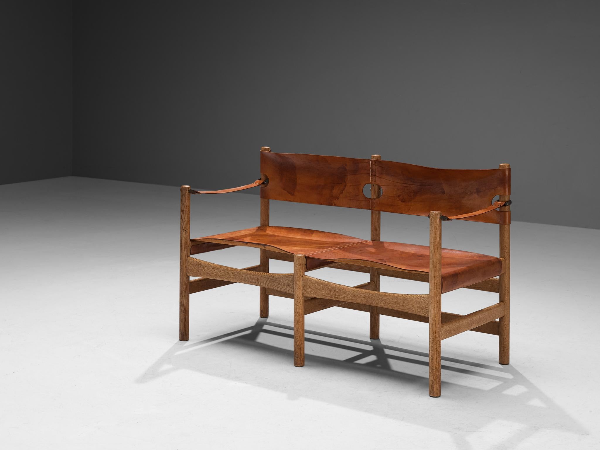 Børge Mogensen for Fredericia Stolefabrik, ‘Safari’ sofa or bench model 2222, saddle leather, oak, brass, Denmark, 1960s.

This rare sofa reminds of the classical foldable 'director-chairs', yet this design by Danish designer Børge Mogensen