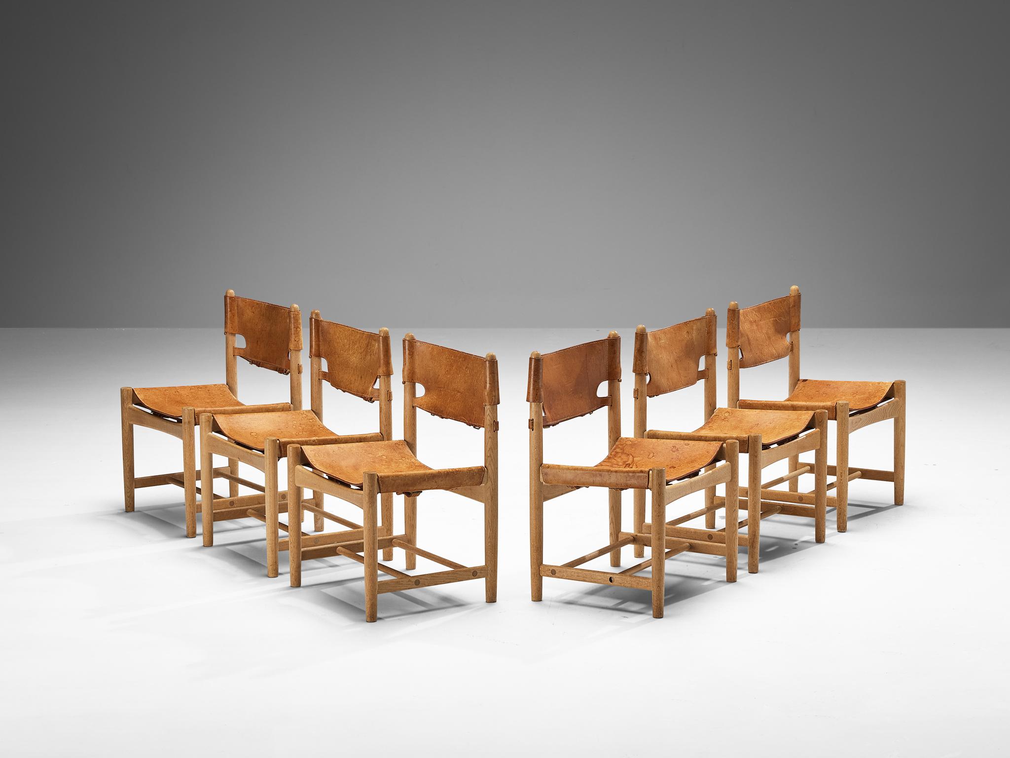Børge Mogensen for Fredericia Stolefabrik, set of six dining chairs, oak, leather, brass, Denmark, 1964

These dining chairs remind of the classical foldable 'director-chairs', yet this design by Danish designer Børge Mogensen (1914-1972) is from a