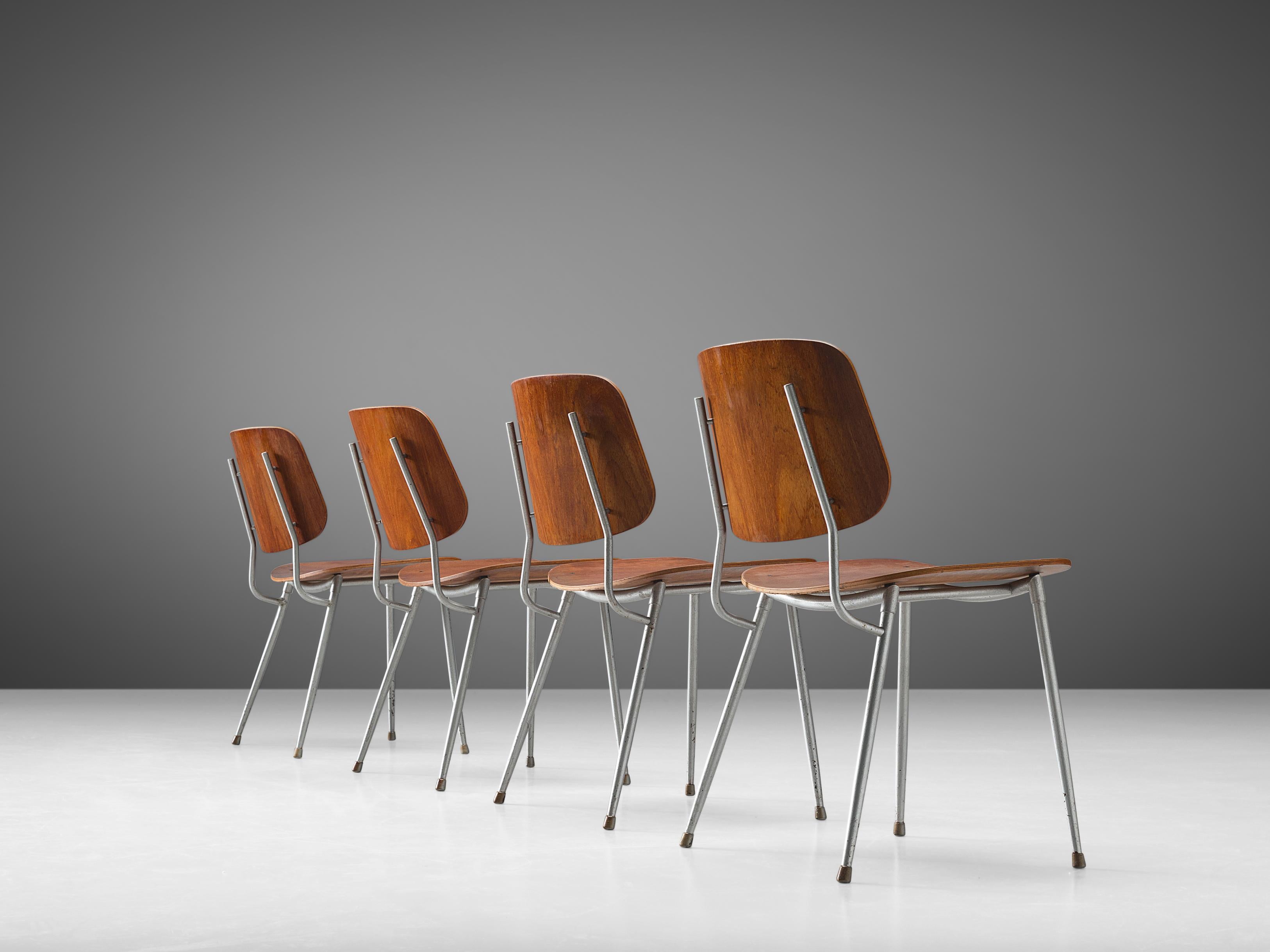 Børge Mogensen for Søborg Møbelfabrik, set of four dining chairs model 201, teak, steel, Denmark, 1953 

This set of four dining chairs features a slender steel frame with molded teak seat and back. The chair consists of two wide and slightly curved