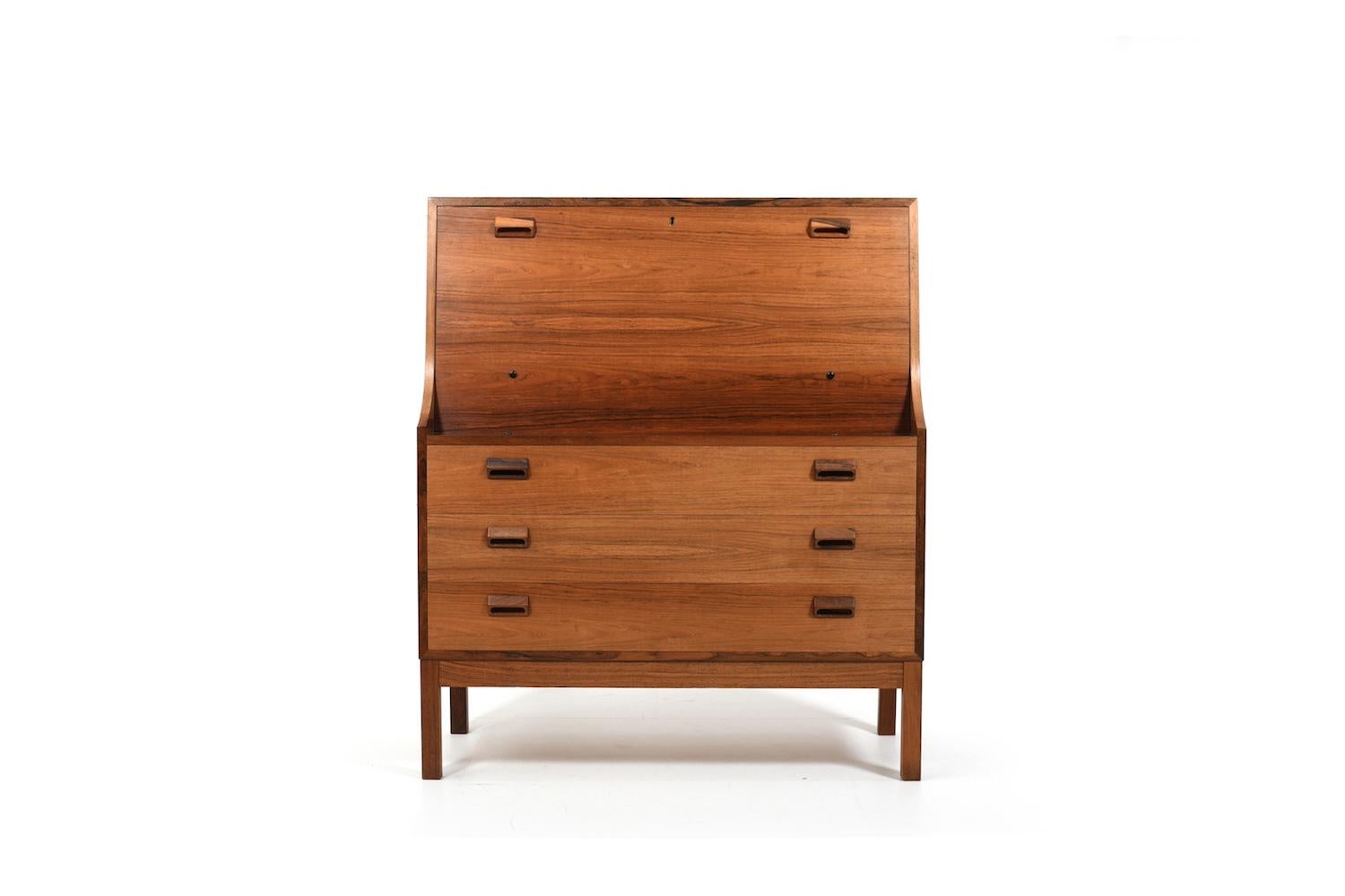 Secretary desk / cabinet, designed in 1950s by Børge Mogensen for Søborg Møbelfabrik Denmark. Made in fine walnut early 1960s. Front with three drawers and a writing flap. Behind the flap with 2 small drawers and open shelfes.