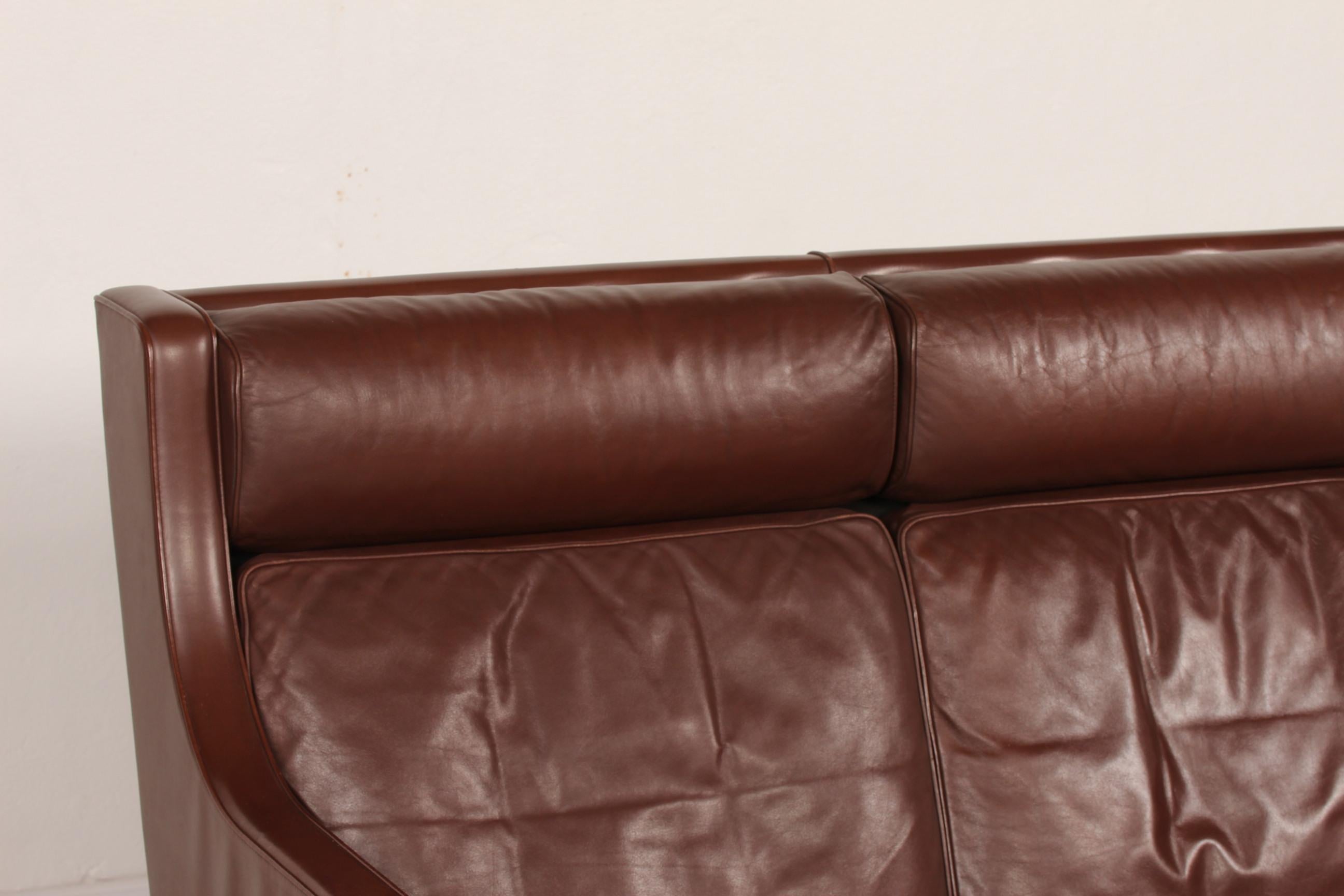 Danish vintage Børge Mogensen (1914-1972) sofa for 2 persons model no. 2432 with high back.
It's upholstered with the original chocolate brown leather. The legs are made of solid oak. 
The cushions are filled inside with granules and natural