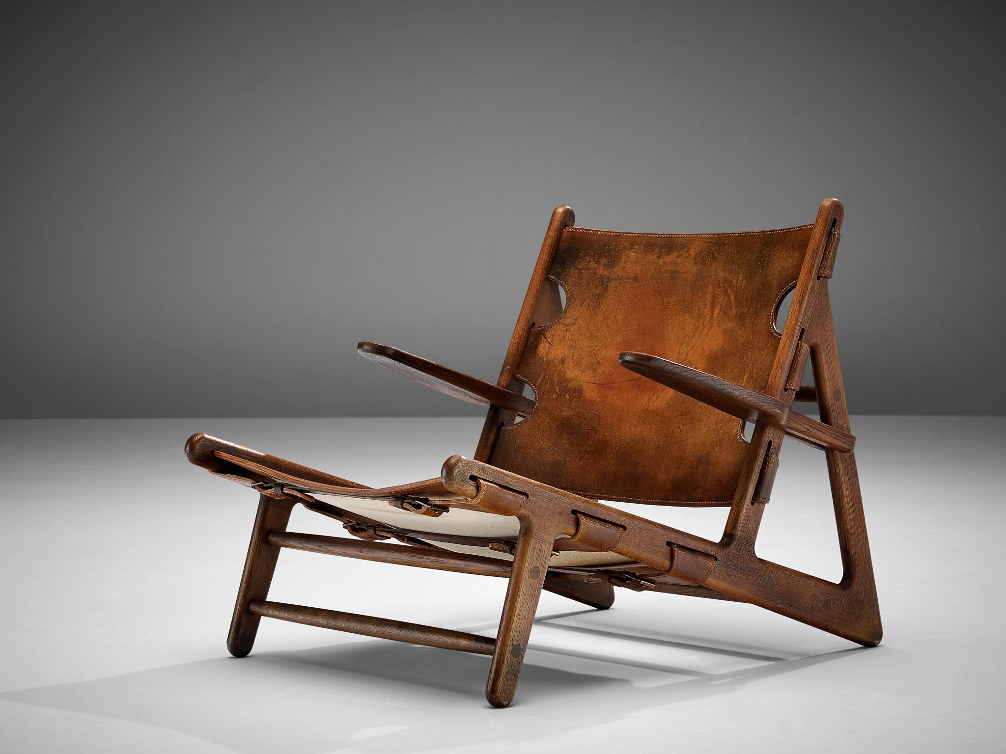 Børge Mogensen, 'Hunting Chair', model 2229, patinated leather, darkened oak, brass, Denmark, designed 1950

Hunting chair, designed by Børge Mogensen in 1950 for the Cabinetmakers Guild Exhibition. The theme of the exhibition was 'Huntin Cabin'.