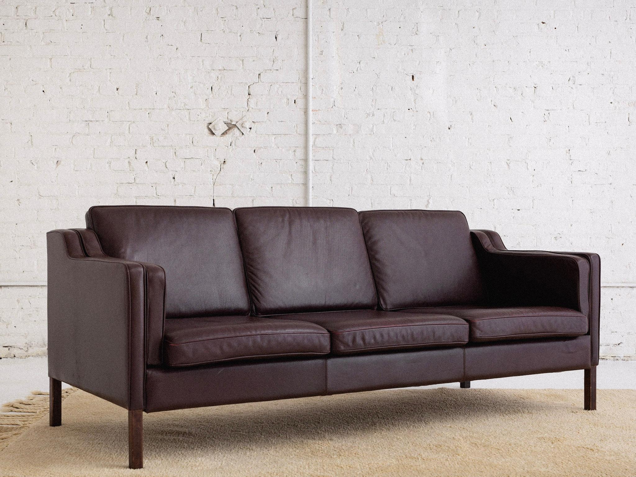 A Danish modern '2213' sofa by Børge Mogensen for Stouby. Original dark burgundy leather and 