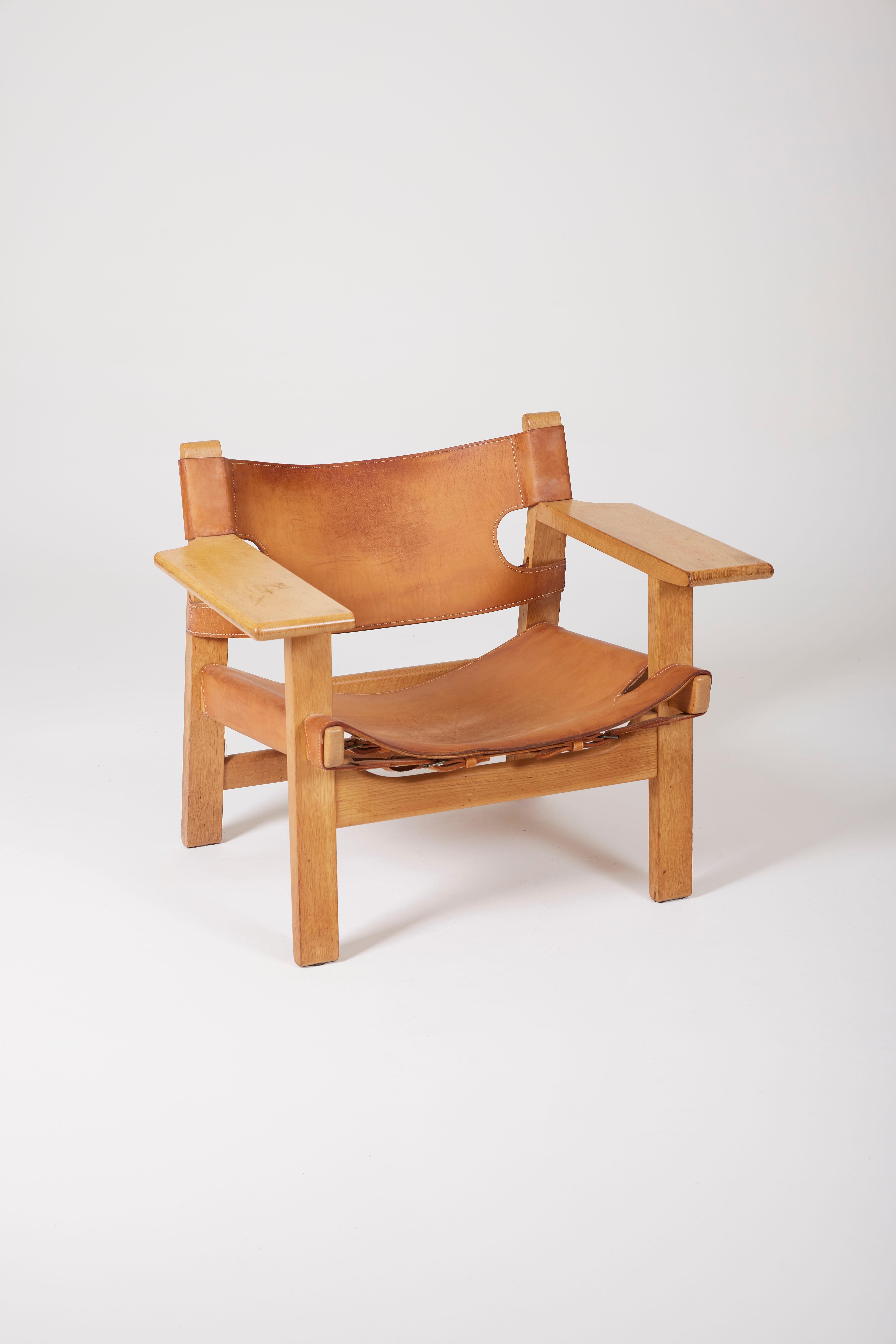 Armchair The Spanish Chair model BM2226 by the Danish designer Børge Mogensen, 1960s. The frame is made of oak. The seat and back are in original worn brown leather. Some signs of time to report, especially on the armrest. Two armchairs