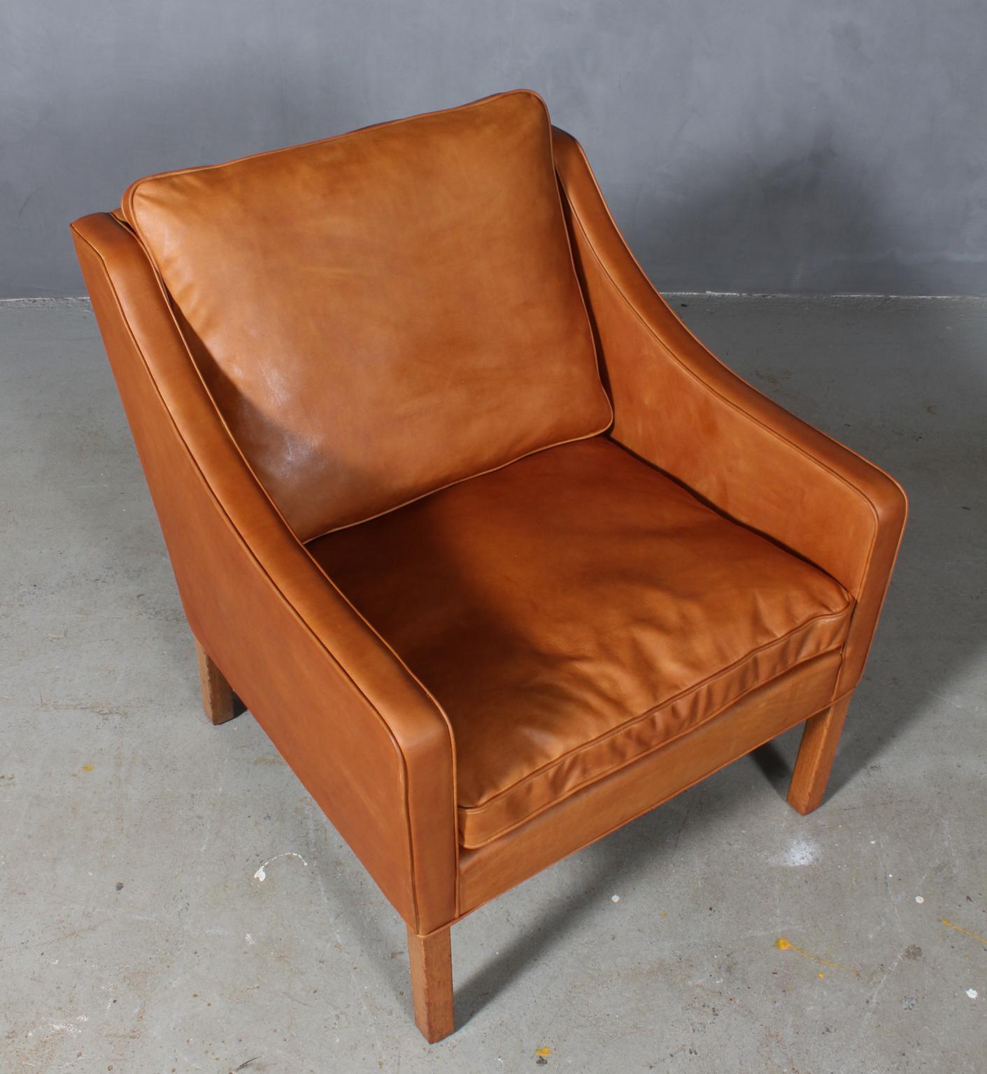 Børge Mogensen lounge chair new upholstered with vintage tan aniline leather.

Legs of teak.

Model 2207, made by Fredericia furniture.