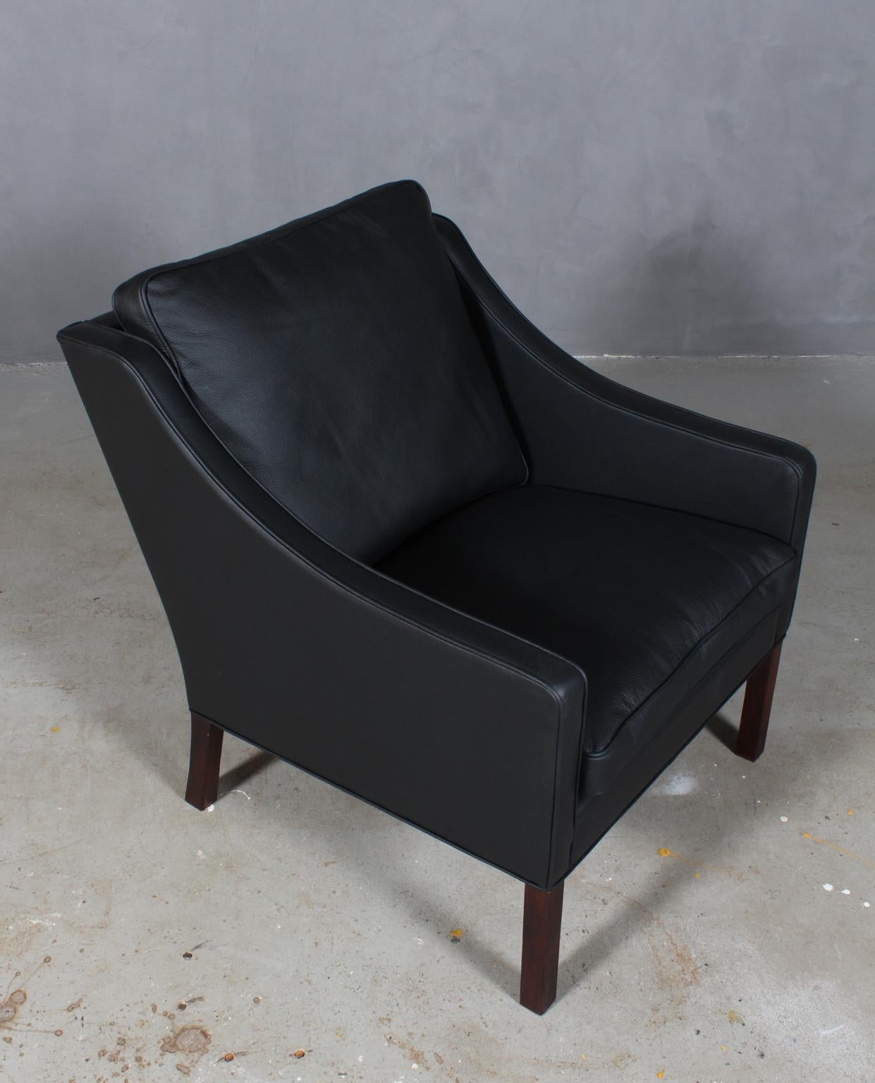 Børge Mogensen lounge chair new upholstered with black leather

Legs of mahogany.

Model 2207, made by Fredericia furniture.