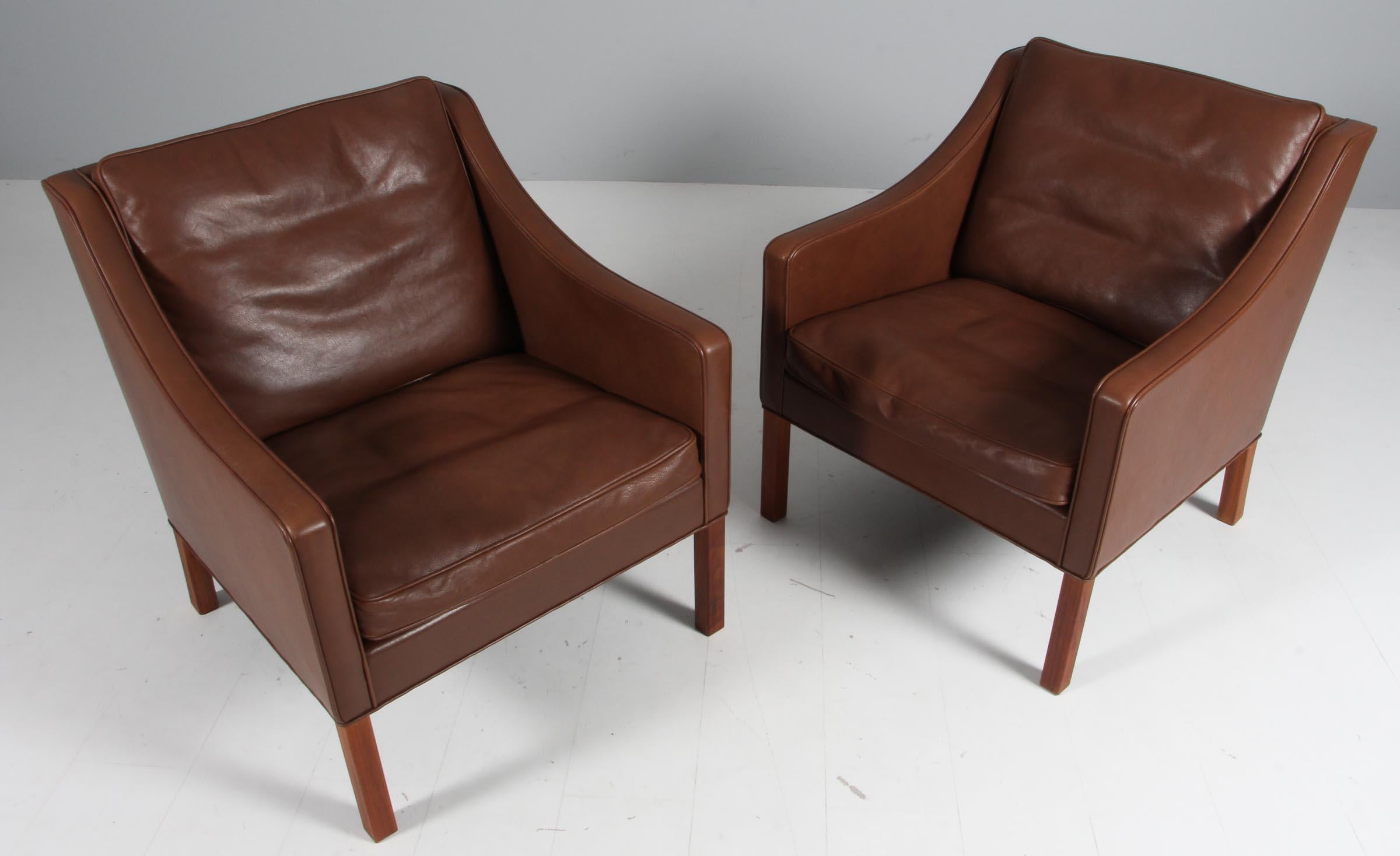 Børge Mogensen lounge chair original upholstered with brown leather.

Legs of mahogany.

Model 2207, made by Fredericia furniture.

Matching three seat, two seat sofa and ottomans available.