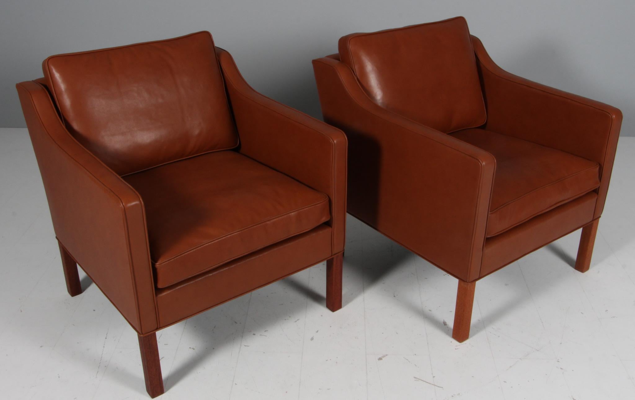 Børge Mogensen lounge chair new upholstered with cognac pure full grain aniline leather.

Legs of mahogany.

Model 2321, made by Fredericia Furniture.