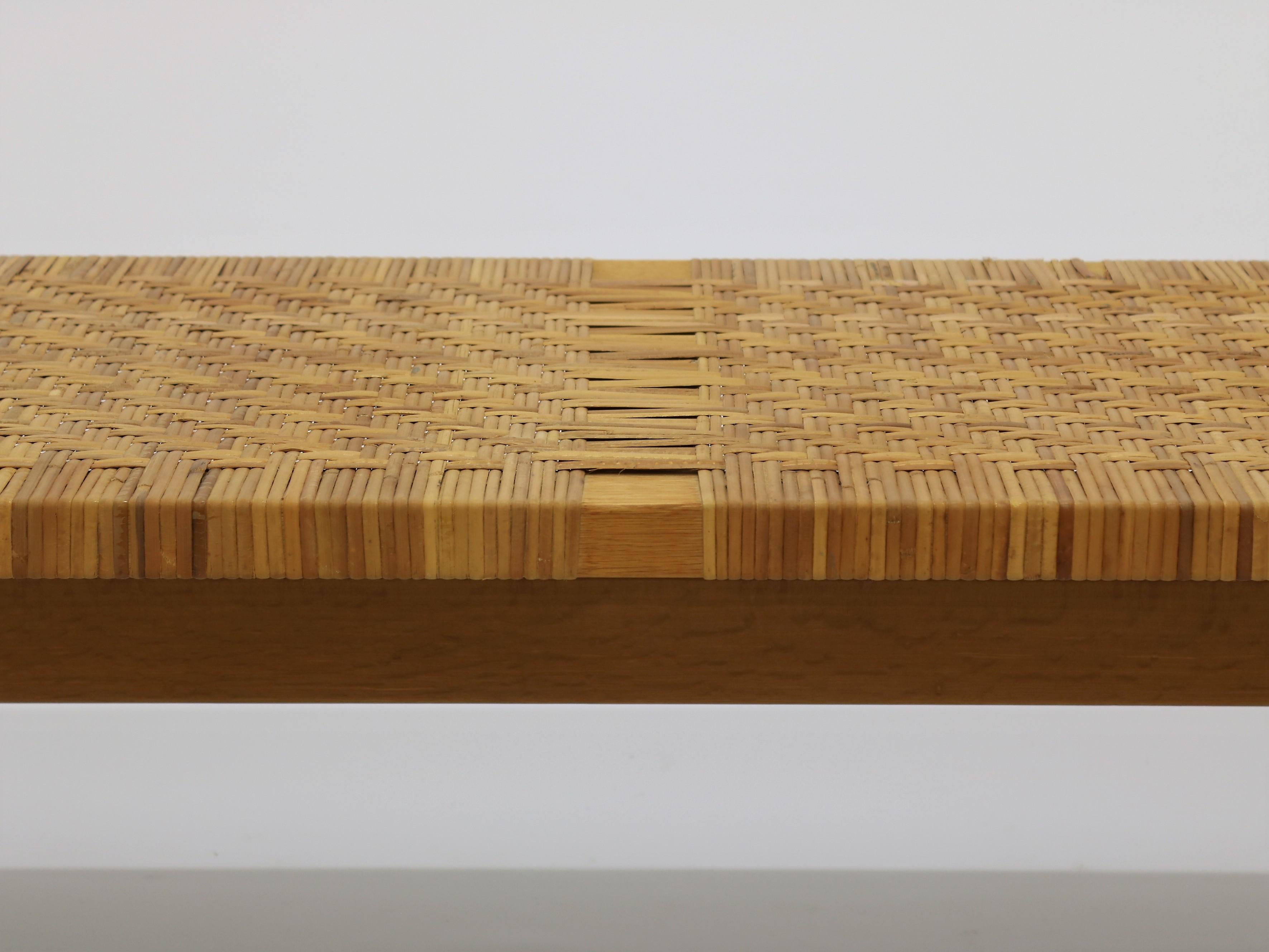 Bench or side table designed by Børge Mogensen in the 1950s for Fredericia Stolefabrik. The unit is made from solid oak and woven cane.