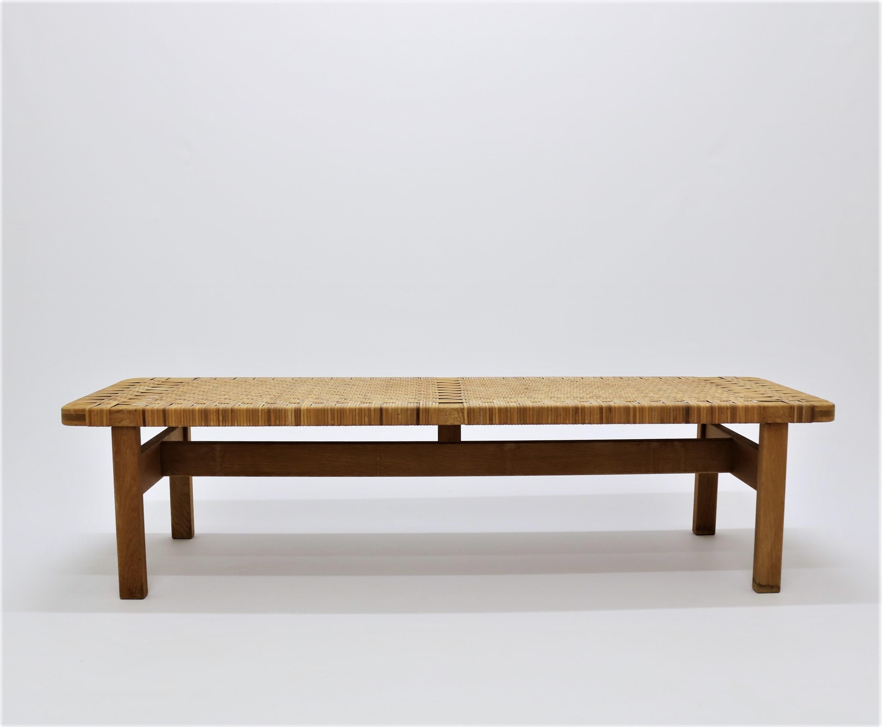 Bench or side table designed by Børge Mogensen in the 1950s for Fredericia Stolefabrik. The unit is made from solid oak and woven cane and is on original vintage condition.