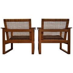 designer cane and oak furniture Børge Mogensen Mid-Century Modern Pair of Oak and Cane Lounge Chairs