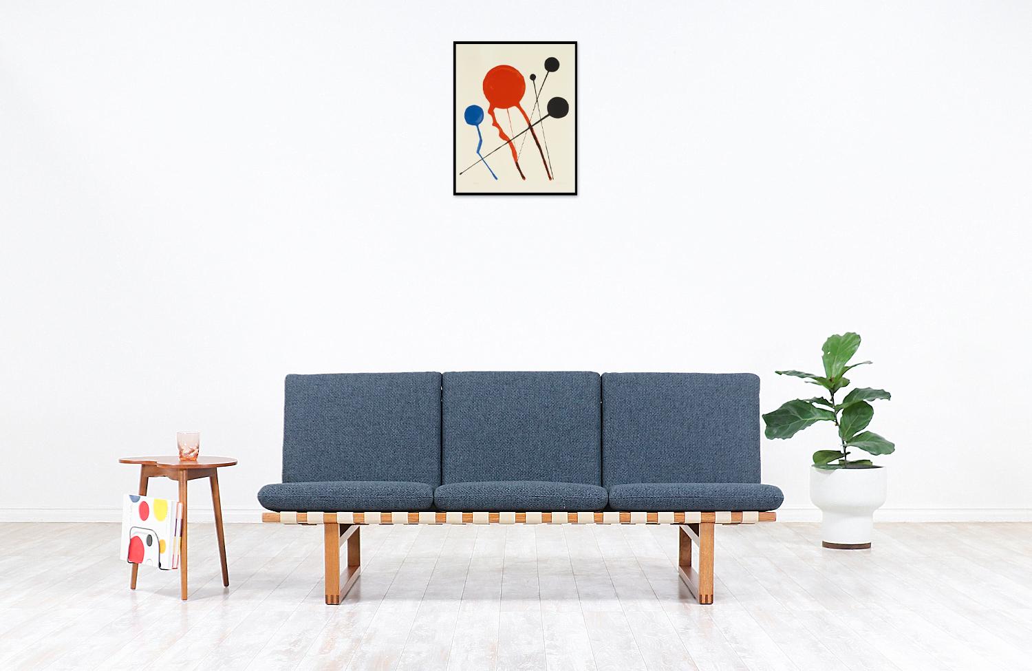 Early vintage Model 211 sofa designed by brilliant Danish architect Børge Mogensen in collaboration with the workshop of Fredericia Stolefabrik in Denmark during the 1950s. Mogensen's philosophy for this line was servicing functionalism and comfort
