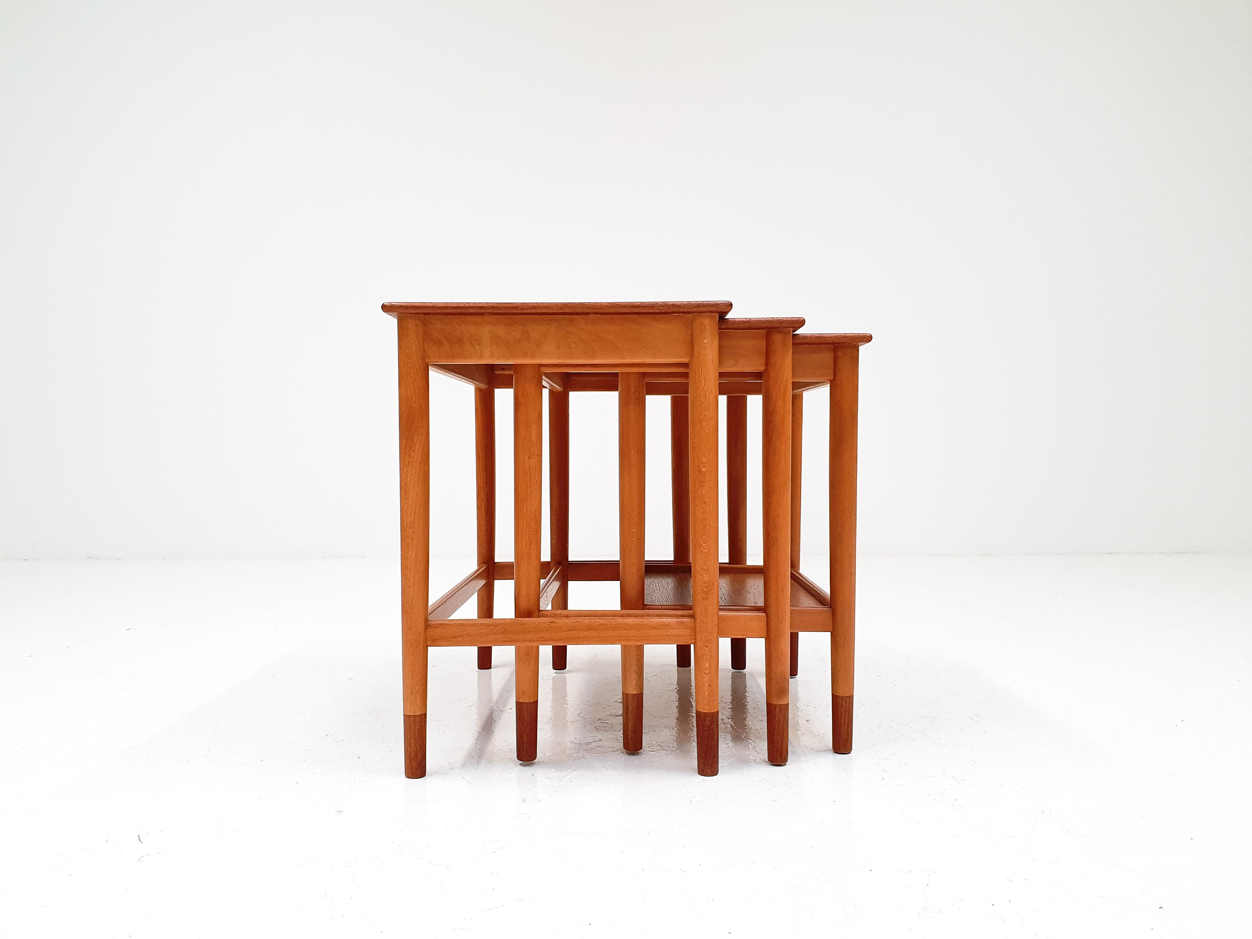 A set of nesting tables by Børge Mogensen. Manufactured by Søborg Møbelfabrik in Denmark, 1960s.

Made from both teak and beech, with teak tabletops and feet and beech frames the contrast in woods offers a very attractive contrast.

The timeless