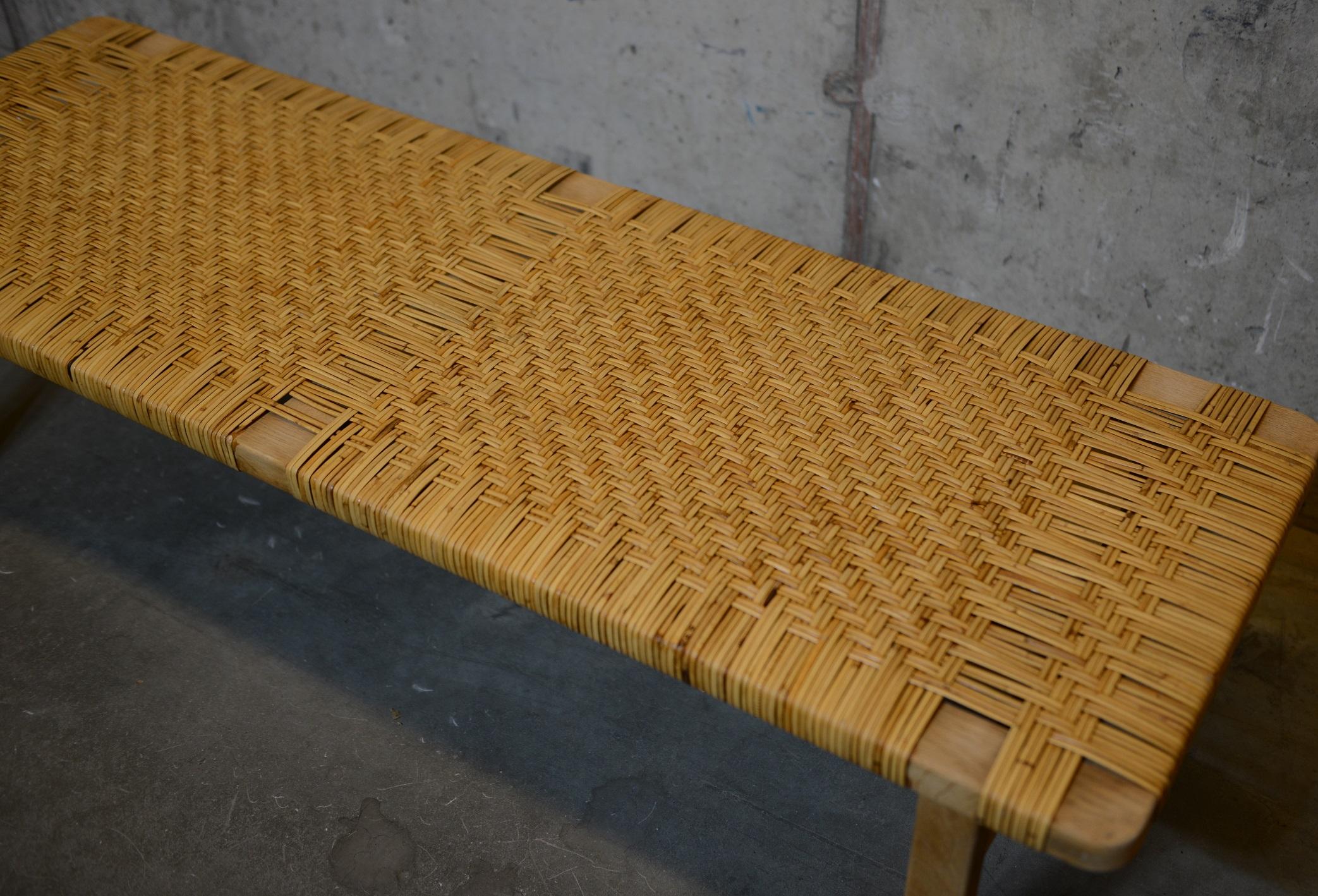 Scandinavian furniture design by Danish designer Børge Mogensen. Produced in the 1960s by Fredericia Furniture in Denmark. This bench is made of oak and rattan / cane. Quality in design, materials and craftsmanship.