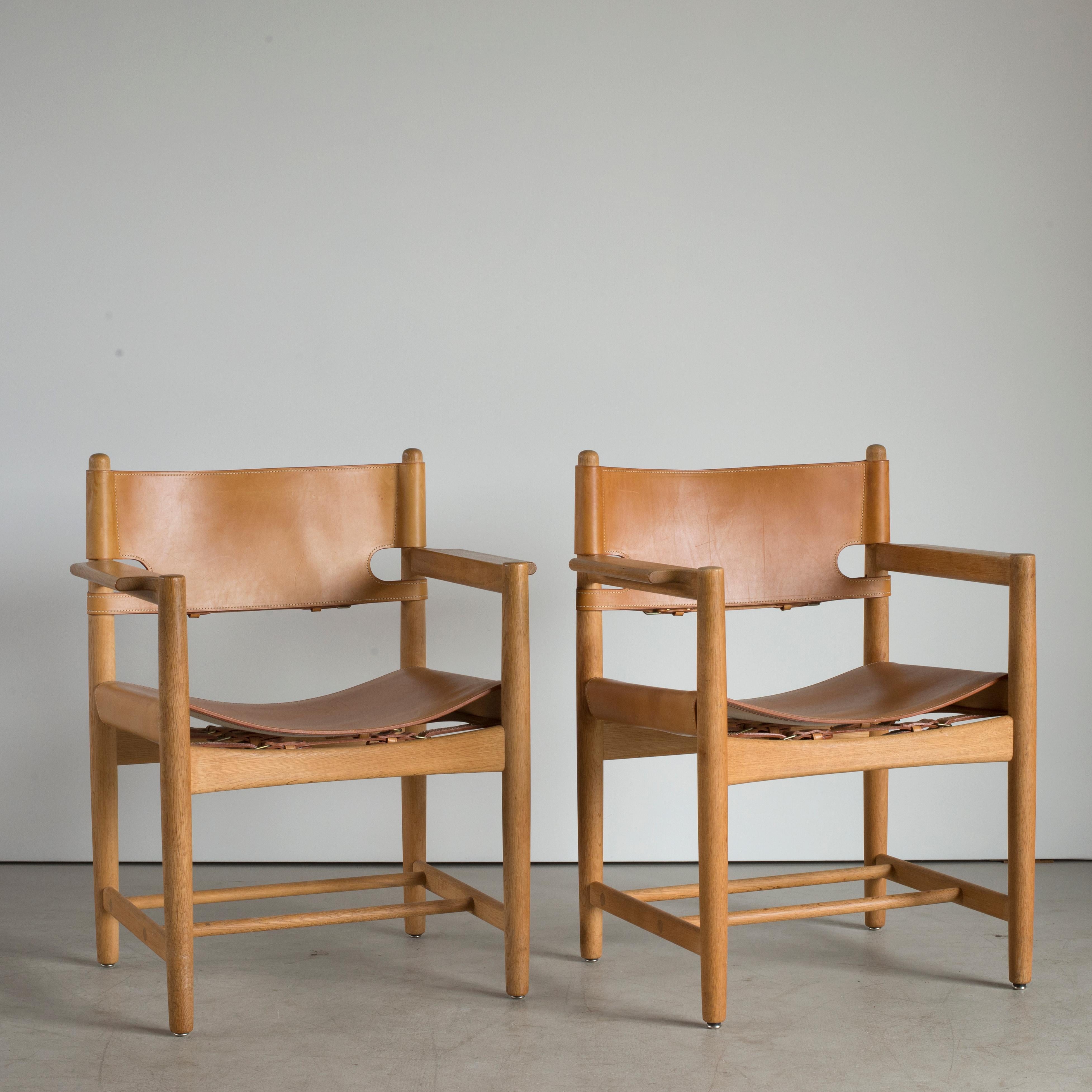 Børge Mogensen pair of armchairs in oak and natural leather. Executed by Fredericia Furniture.