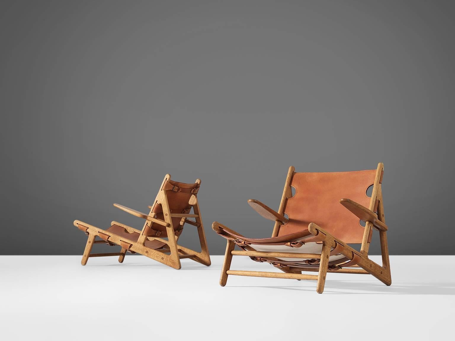 Børge Mogensen for Fredericia Stolefabrik, hunting chairs, oak and cognac saddle leather, Denmark 1950. 

The hunting chair was Mogensens first work with a solid wooden frame and saddle leather seating. This iconic piece was the first in a line of