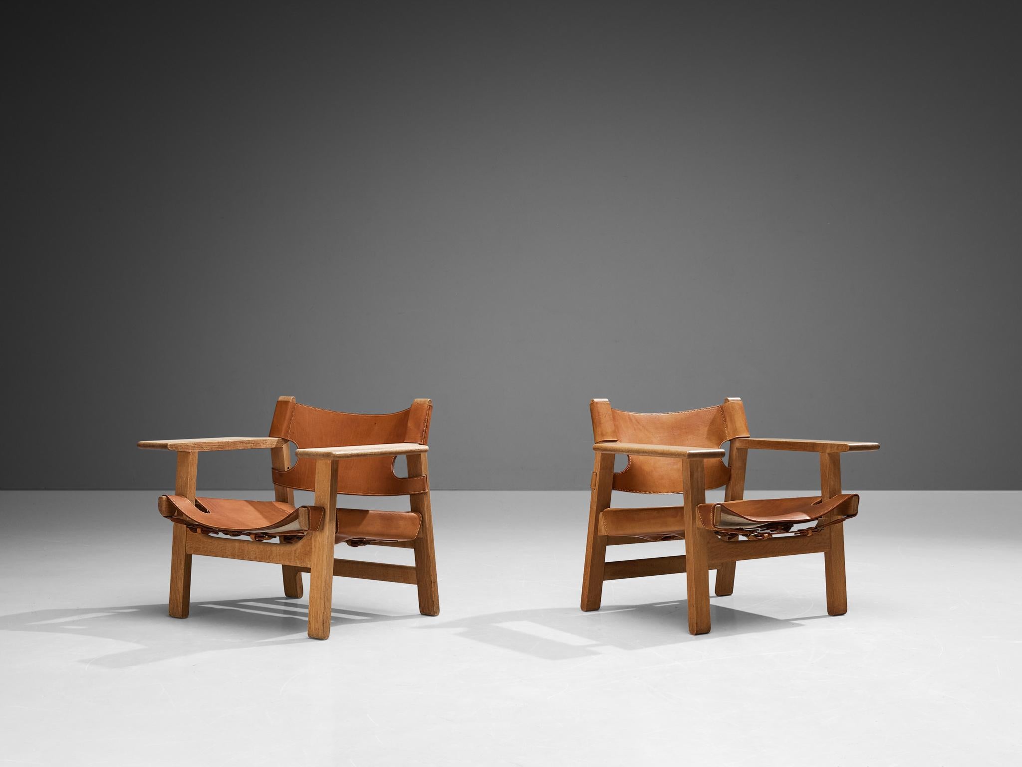 Børge Mogensen for Fredericia Stolefabrik, pair of 'Spanish Chairs,' oak, leather, brass, Denmark, 1958.

This well-known design by Børge Mogensen has a very strong appearance. The sincere construction and type of upholstery, give the chair a