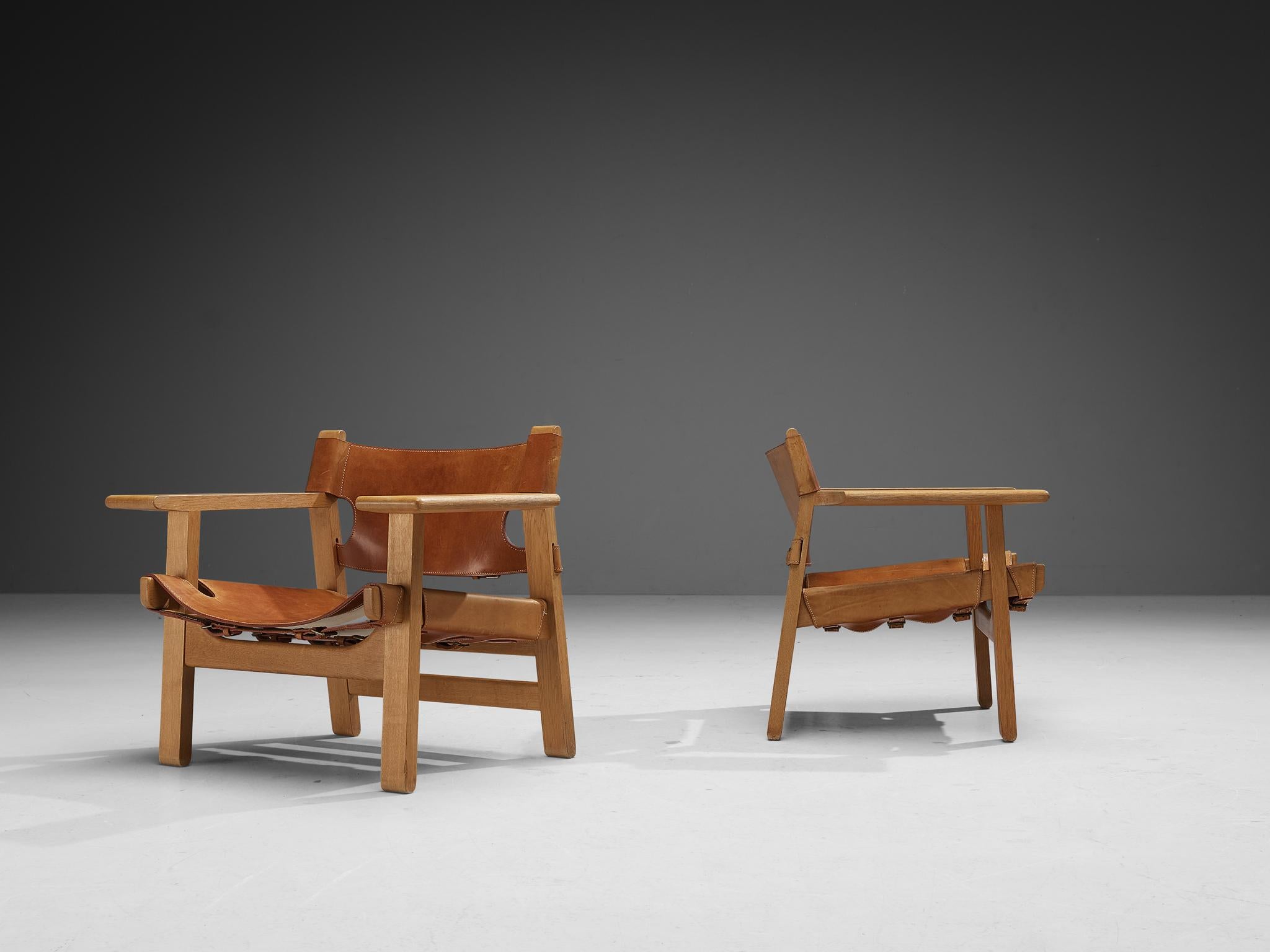 Børge Mogensen for Fredericia Stolefabrik, pair of 'Spanish Chairs,' oak, leather, brass, Denmark, 1958.

This well-known design by Børge Mogensen has a very strong appearance. The sincere construction and type of upholstery, give the chair a