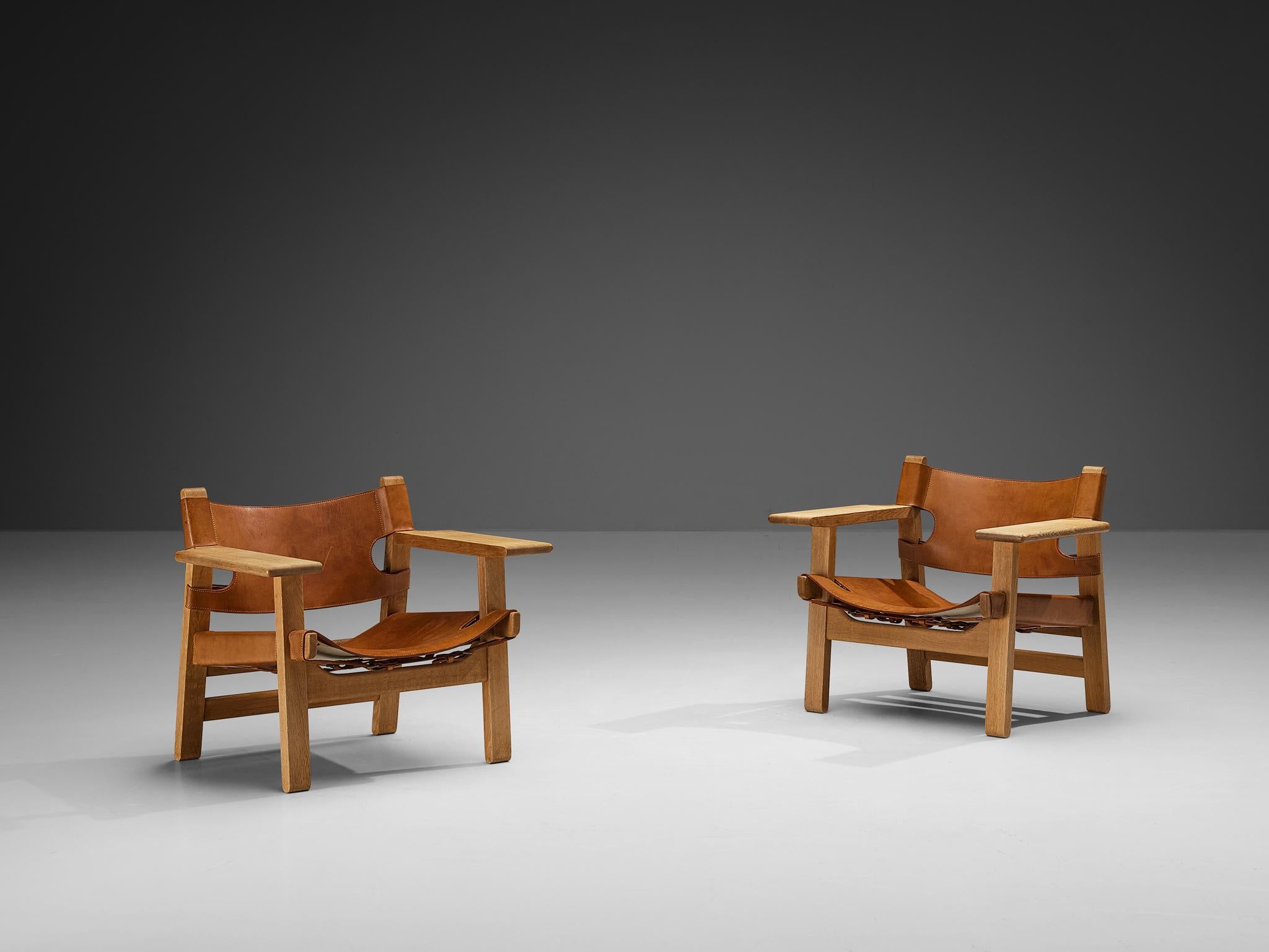 Børge Mogensen for Fredericia Stolefabrik, pair of 'Spanish Chairs,' oak, leather, brass, Denmark, 1958

This well-known design by Børge Mogensen has a very strong appearance. The sincere construction and type of upholstery, give the chair a