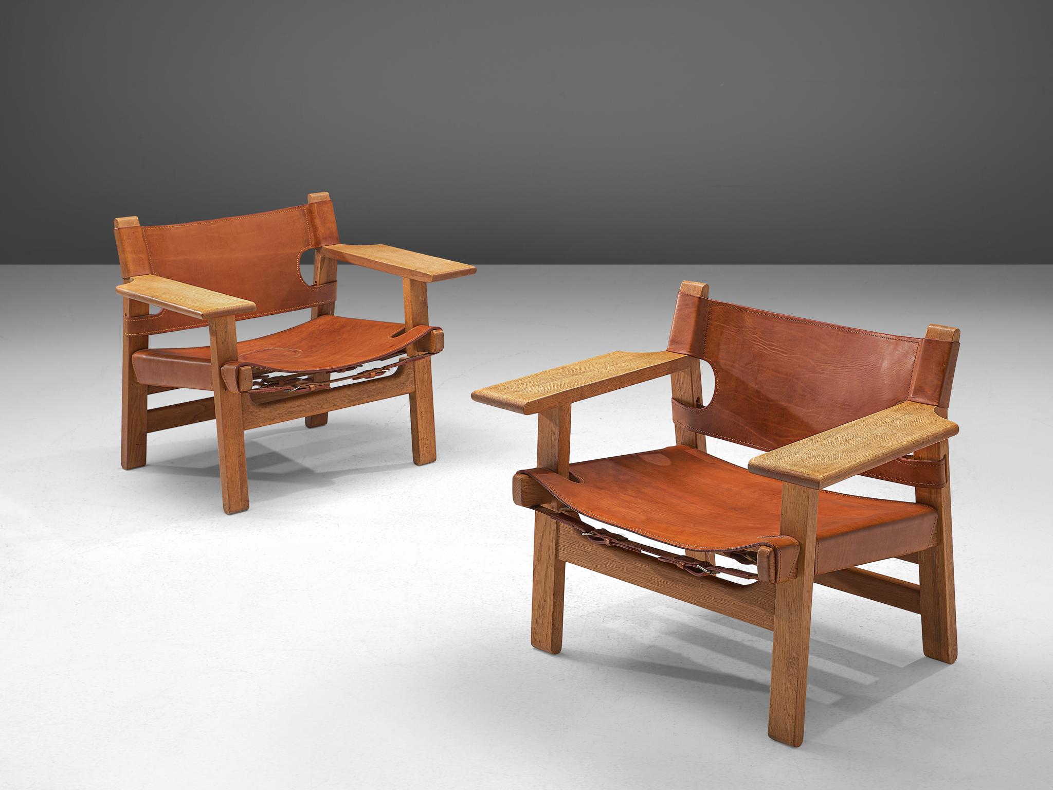 Børge Mogensen for Fredericia Stolefabrik, set of 2 'Spanish Chairs,' solid oak and cognac leather, Denmark, 1958.

This well-known design by Børge Mogensen has a very strong appearance. The sincere construction and type of upholstery, give the