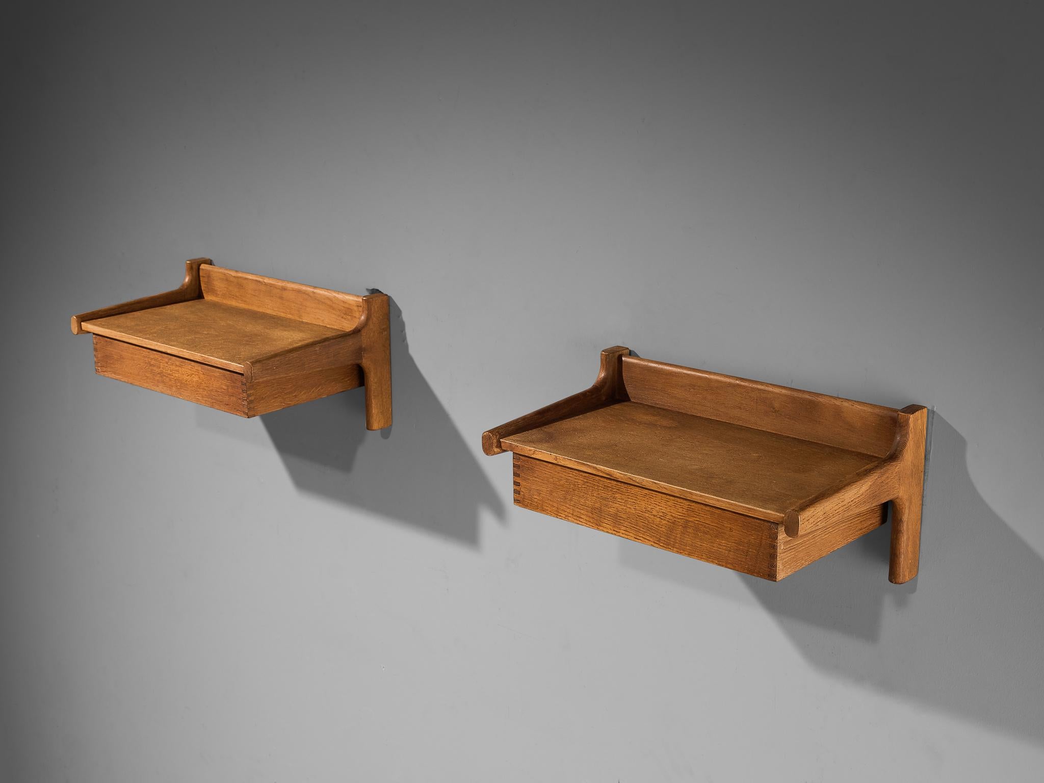 Børge Mogensen, pair of bedside shelves, oak, Denmark, 1955

This pair is well-constructed in a precise manner implementing clear lines and shapes, resulting in an eloquent and simplistic furniture piece that is typical for Danish design. In the