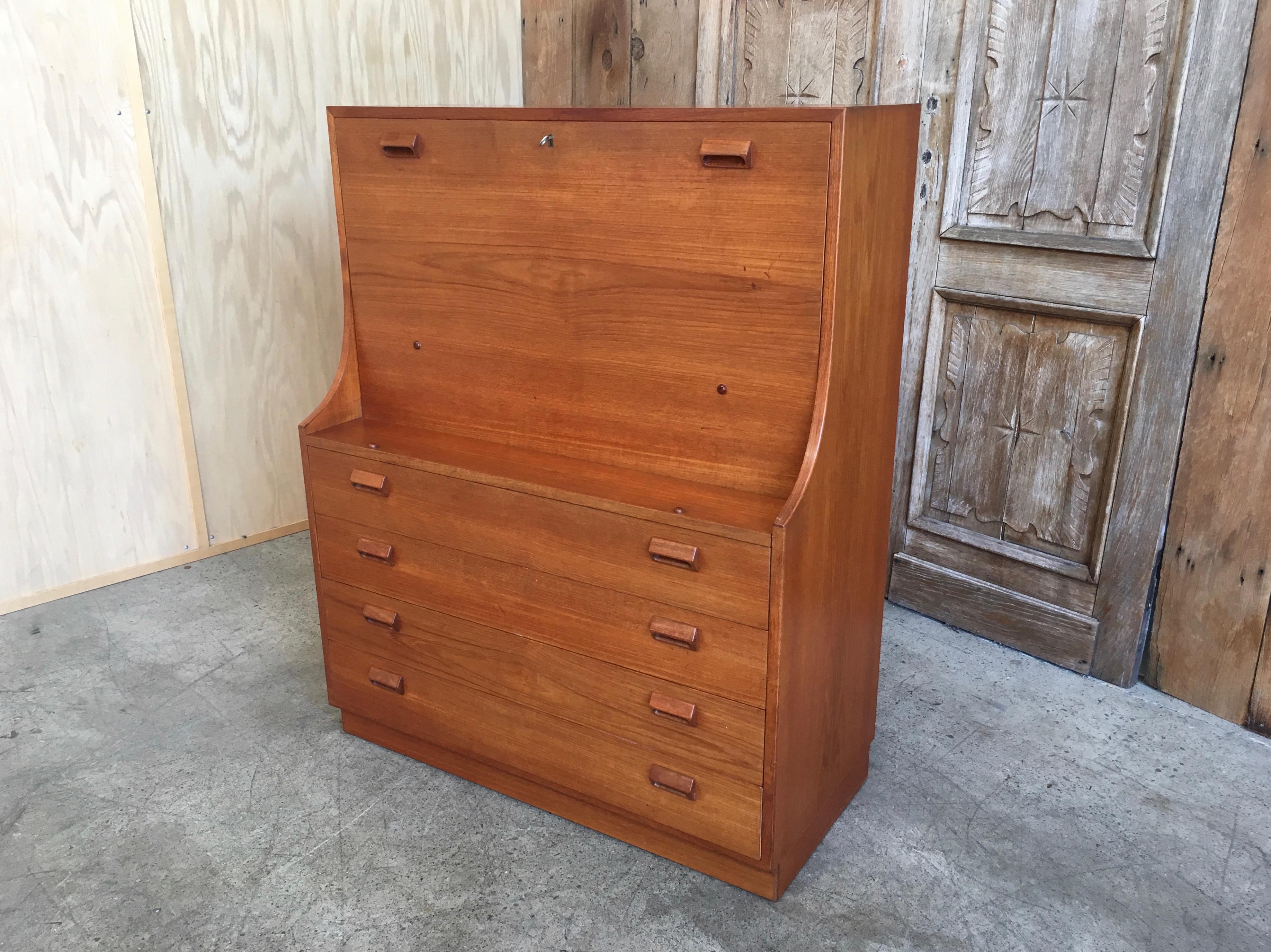 Beautiful Danish Modern upright cabinet that also serves as a desk
Height of desk top 27.25
