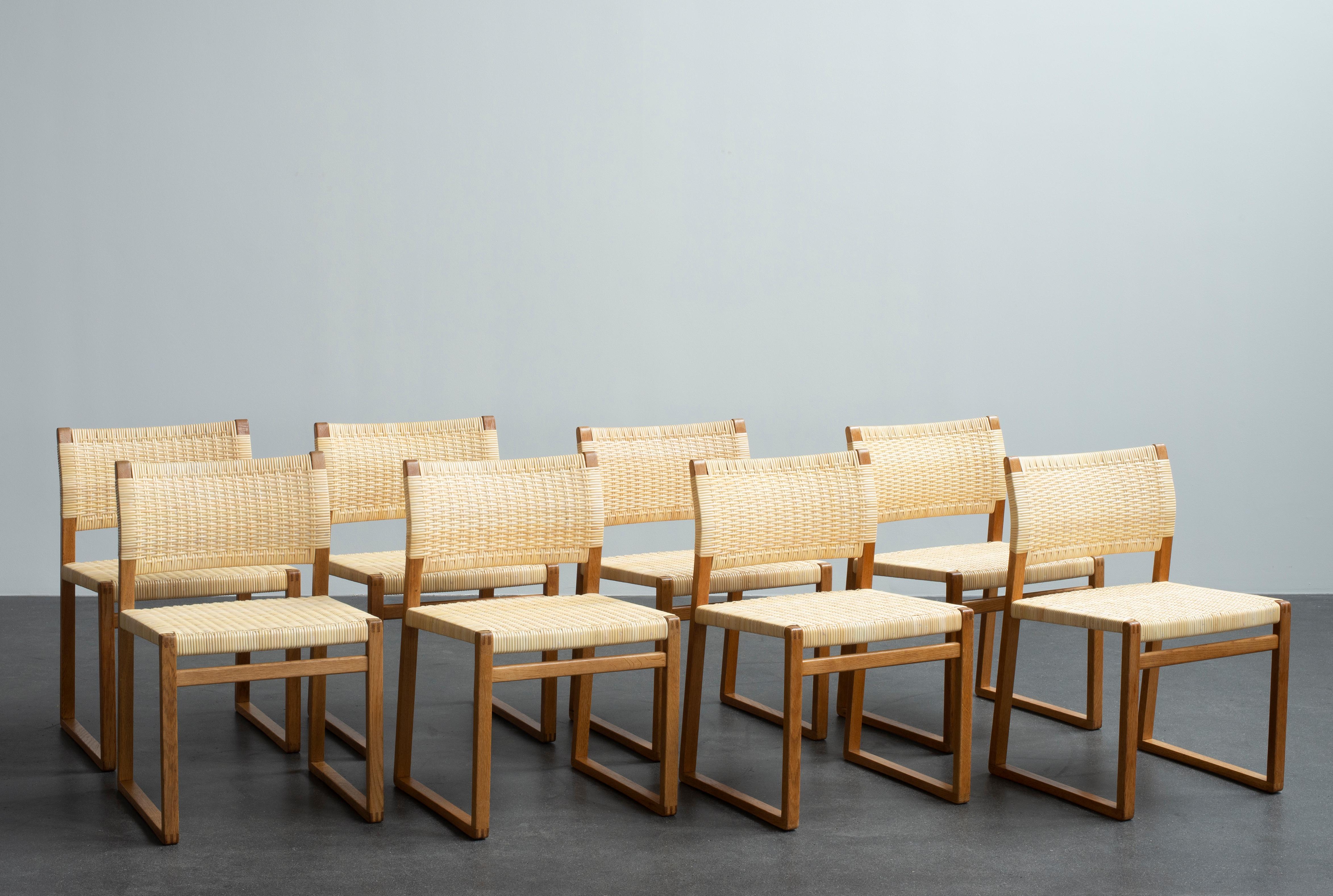 Børge Mogensen set of eight chairs in oak, seat and back with cane. Model BM61, Executed by P. Lauritzen & Son.