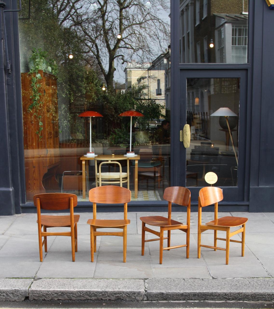 A rare set of eight Model #156 dining chairs designed by Børge Mogensen and made by Søborg Møbelfabrik in 1952. The seat and back rests of the chairs are teak plywood whilst the frames of the chairs are in oak. True to one of the main tenets of