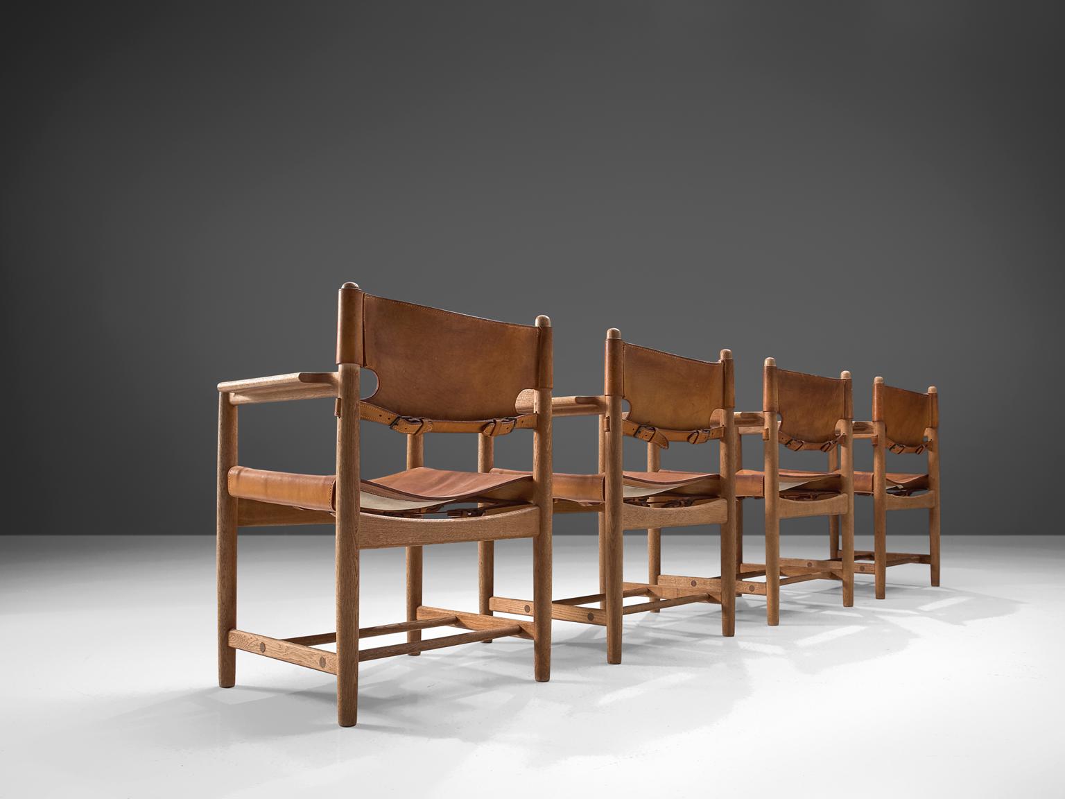 Børge Mogensen for Fredericia Stolefabrik, set of 4 chairs model 3238, in oak and leather, Denmark, 1964. 

Set of four armchairs in solid oak. These chairs remind of the classical foldable 'director-chairs', yet this design by Danish designer