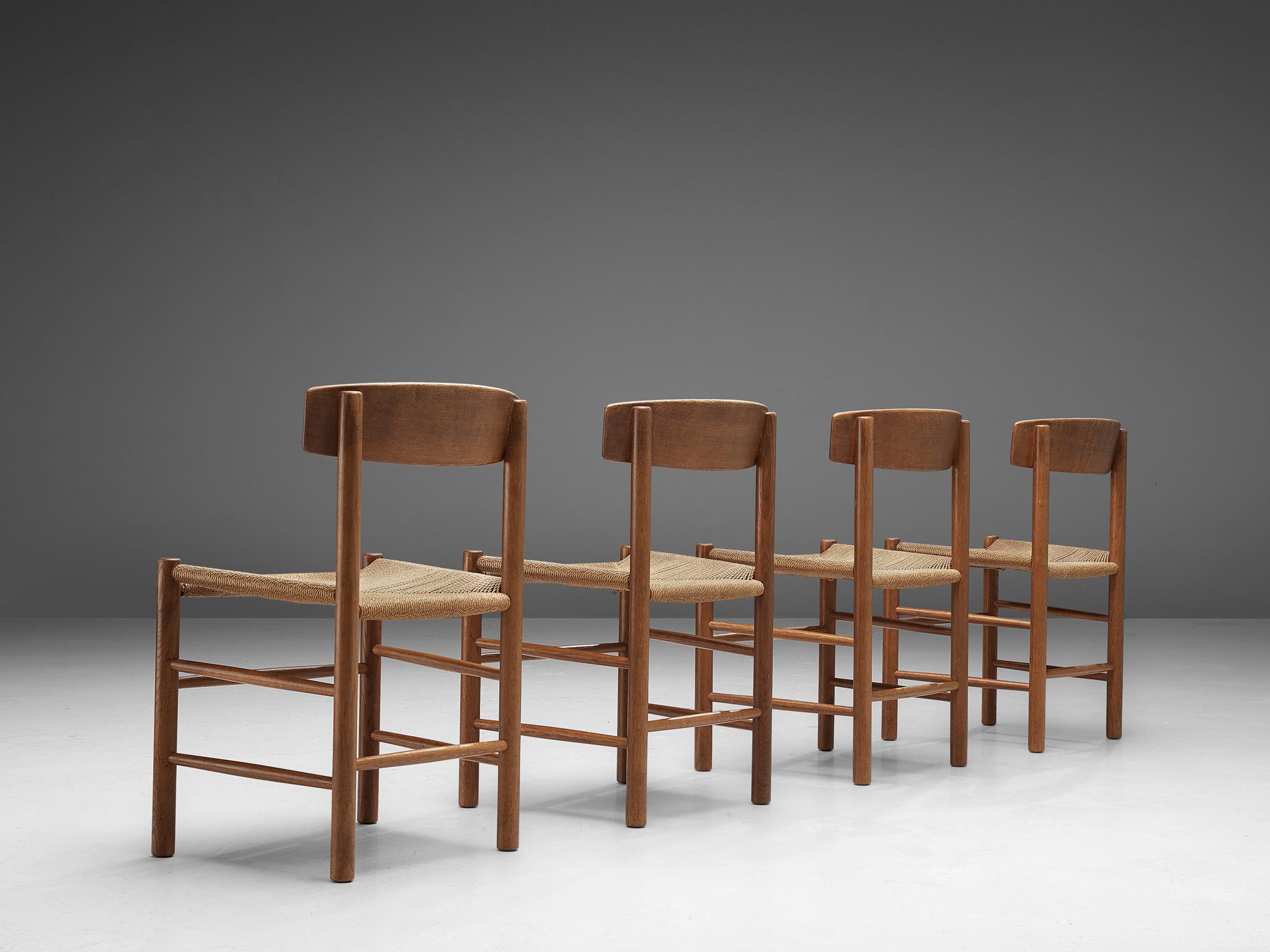 Børge Mogensen for FDB Møbler, set of four dining chairs model 'J39', oak, paper cord, Denmark, design 1947.

The design of Børge Mogensen's J39 design is in many ways aesthetically pleasing. Not only provides the handwoven paper cord a great