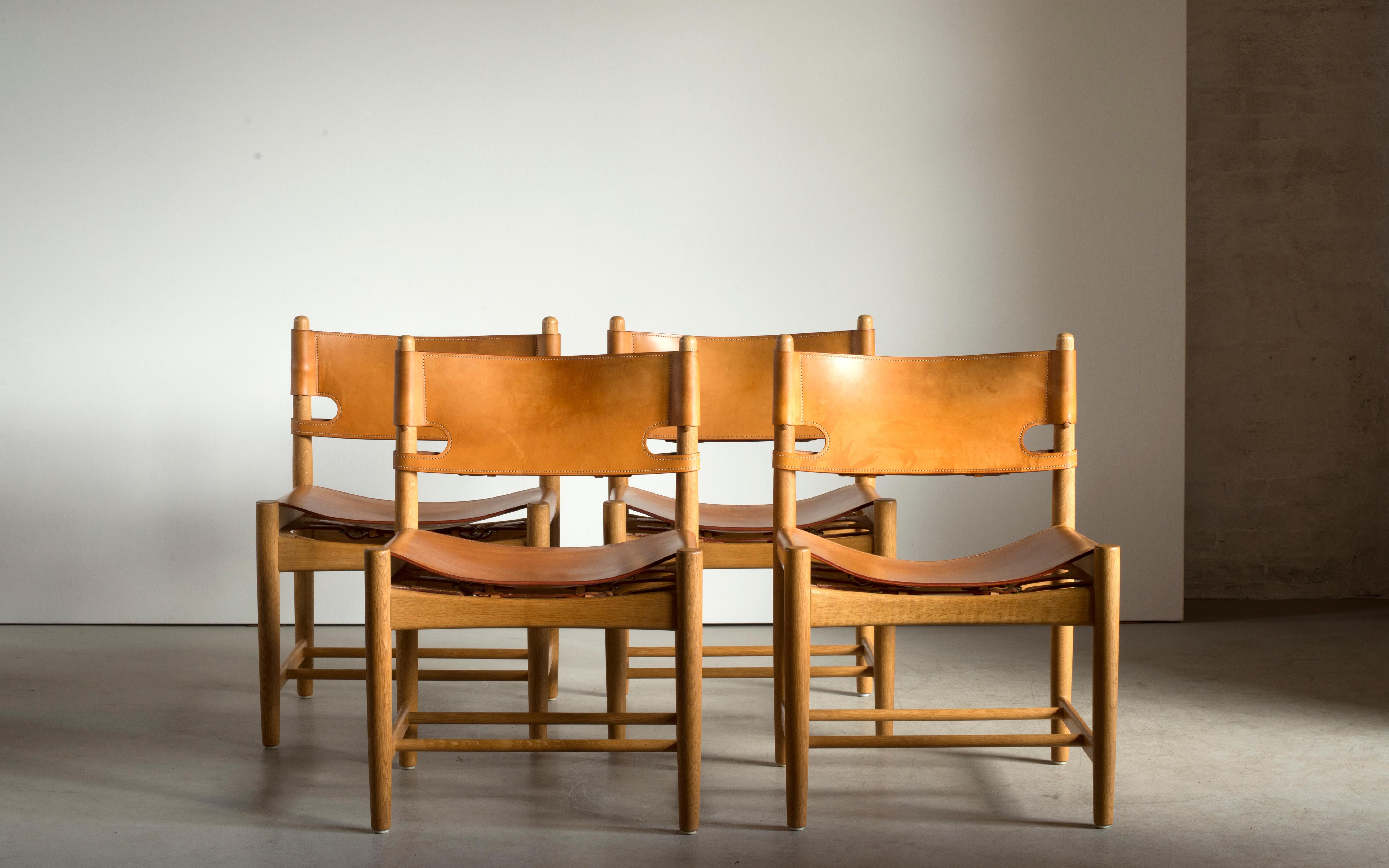 Børge Mogensen set of four dining chairs in oak and natural tanned leather. Executed by Fredericia Furniture.