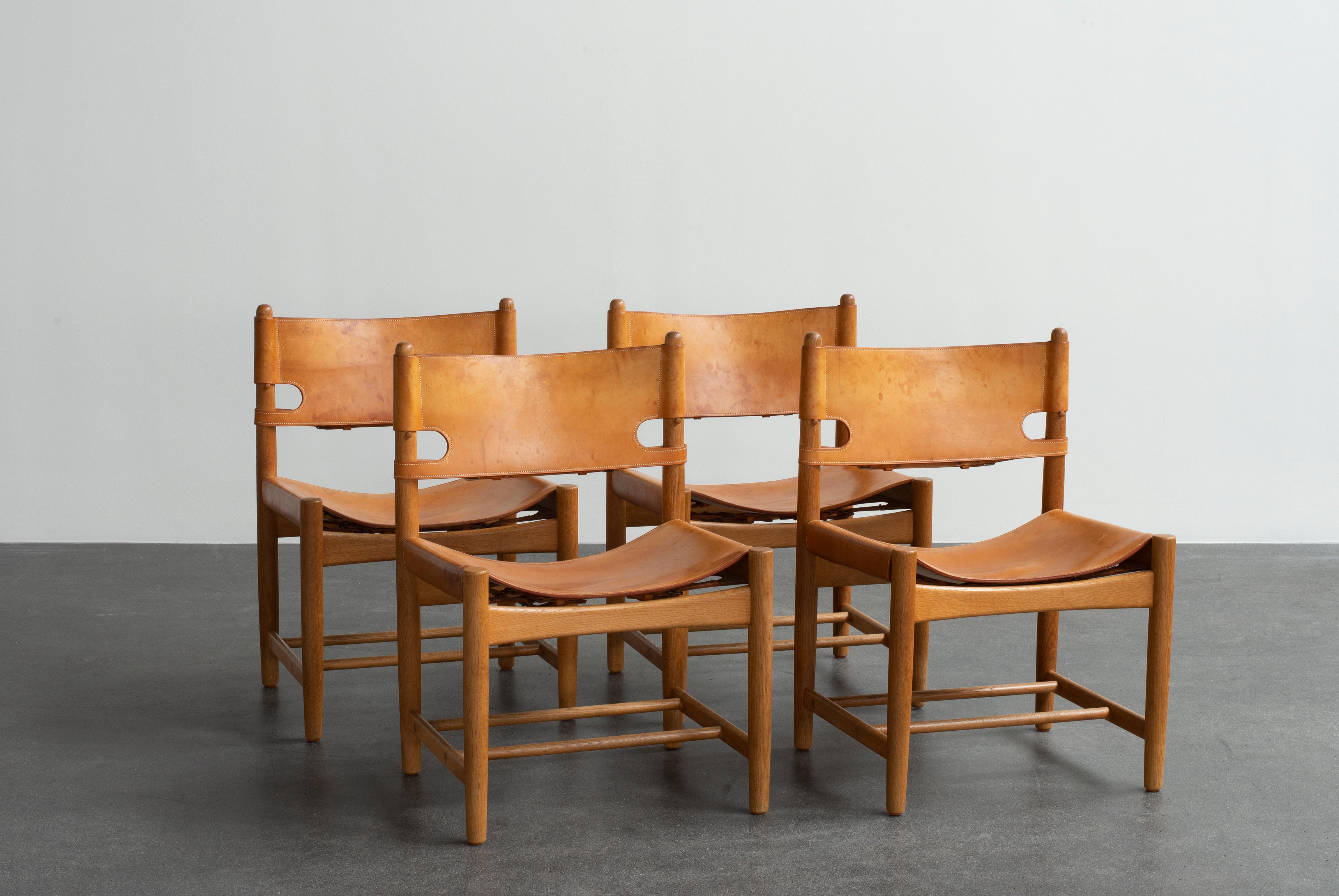 Børge Mogensen set of four dining chairs in oak and natural tanned leather. Executed by Fredericia Furniture.