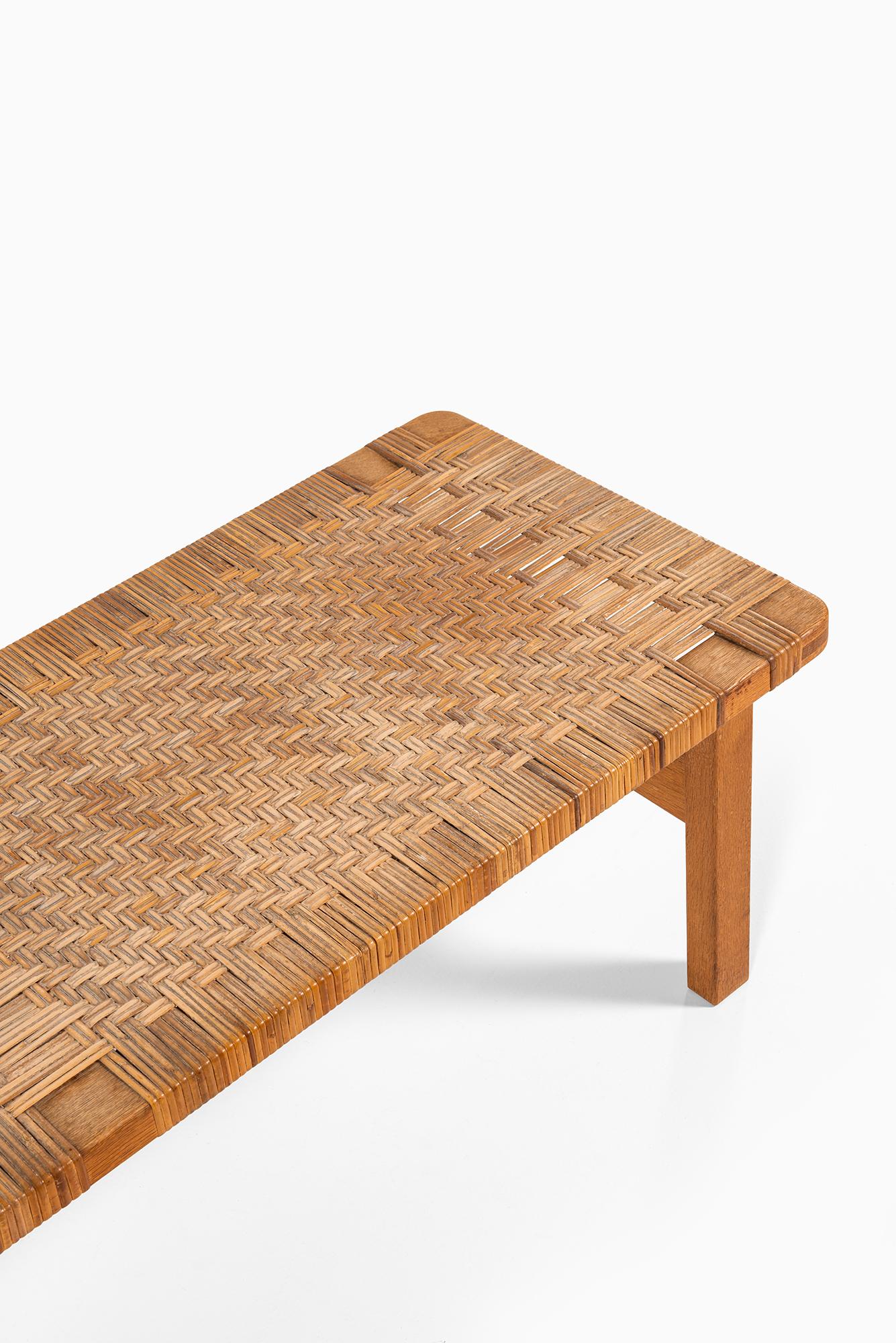 Rare side table in oak and woven cane designed by Børge Mogensen. Produced by Fredericia Stolefabrik in Denmark.