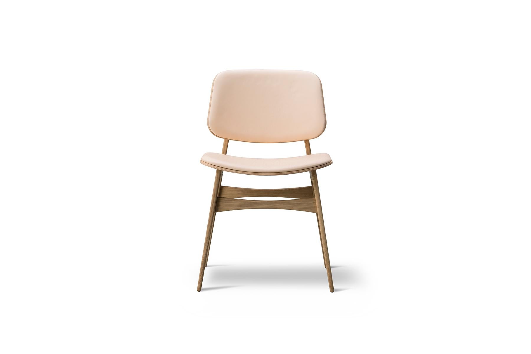 Mogensen presented the prototype for the Børge Mogensen Soborg Chair in 1950. His intention was to fuse plywood shells with his signature solid wood functionalism. The generous back and seat with optional upholstery provides for many hours of use.