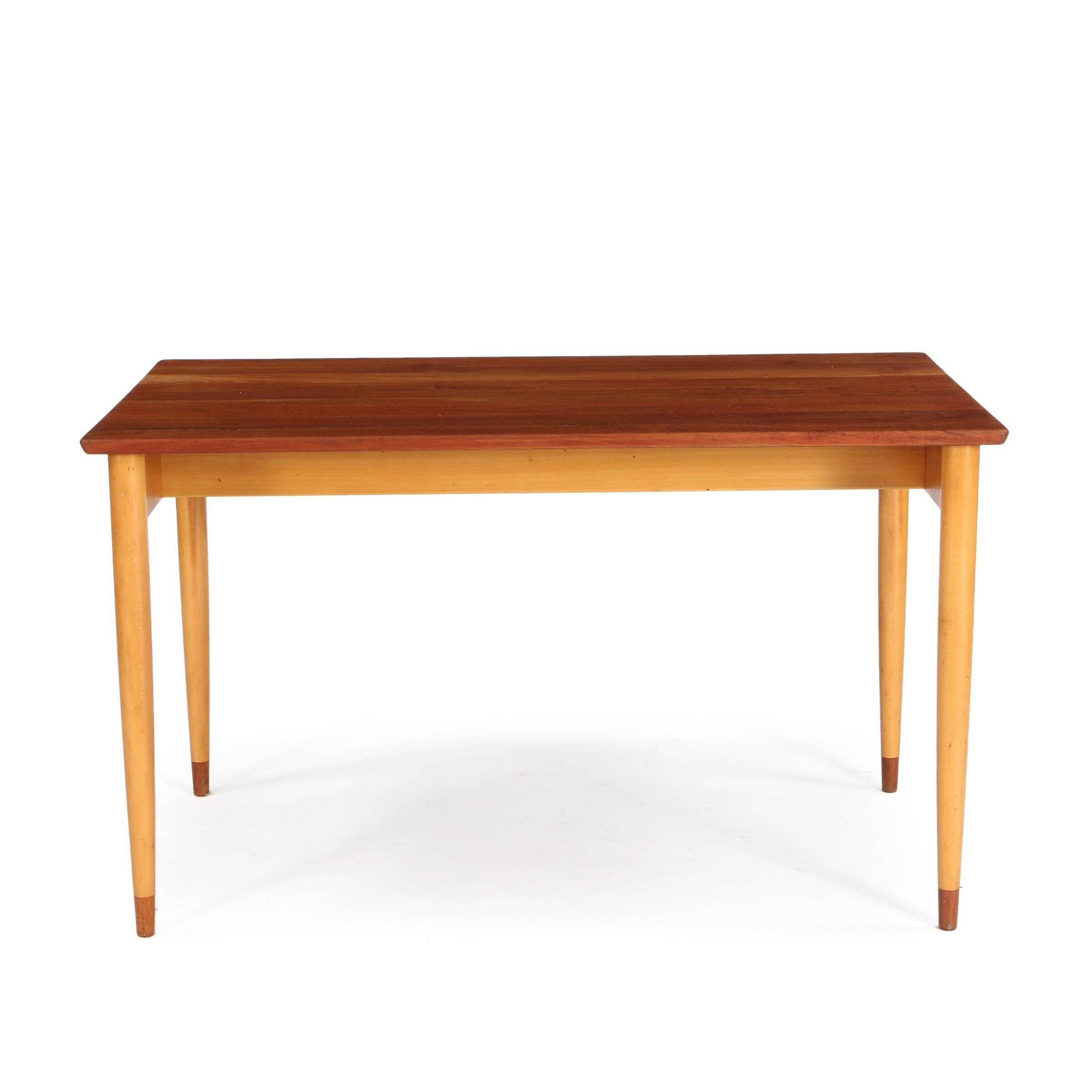 Designed by Børge Mogensen, this dining table or writing table with solid beech frame, solid teak top and shoes of teak is made and stamped by C.M. Madsen. Stamp reads 