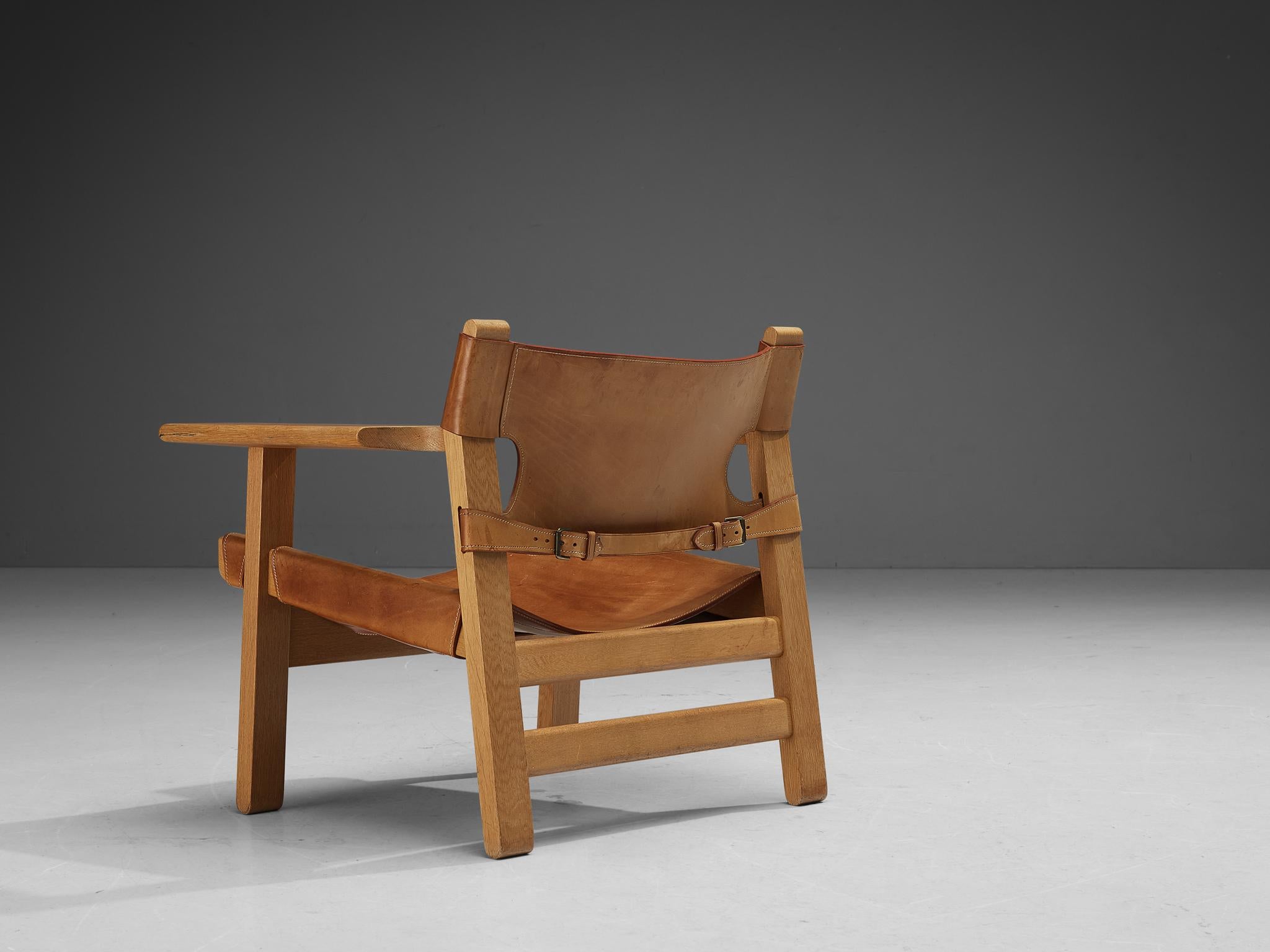 Børge Mogensen for Fredericia Stolefabrik, 'Spanish Chair,' oak, leather, brass, Denmark, 1958.

This well-known design by Børge Mogensen has a very strong appearance. The sincere construction and type of upholstery, give the chair a character of