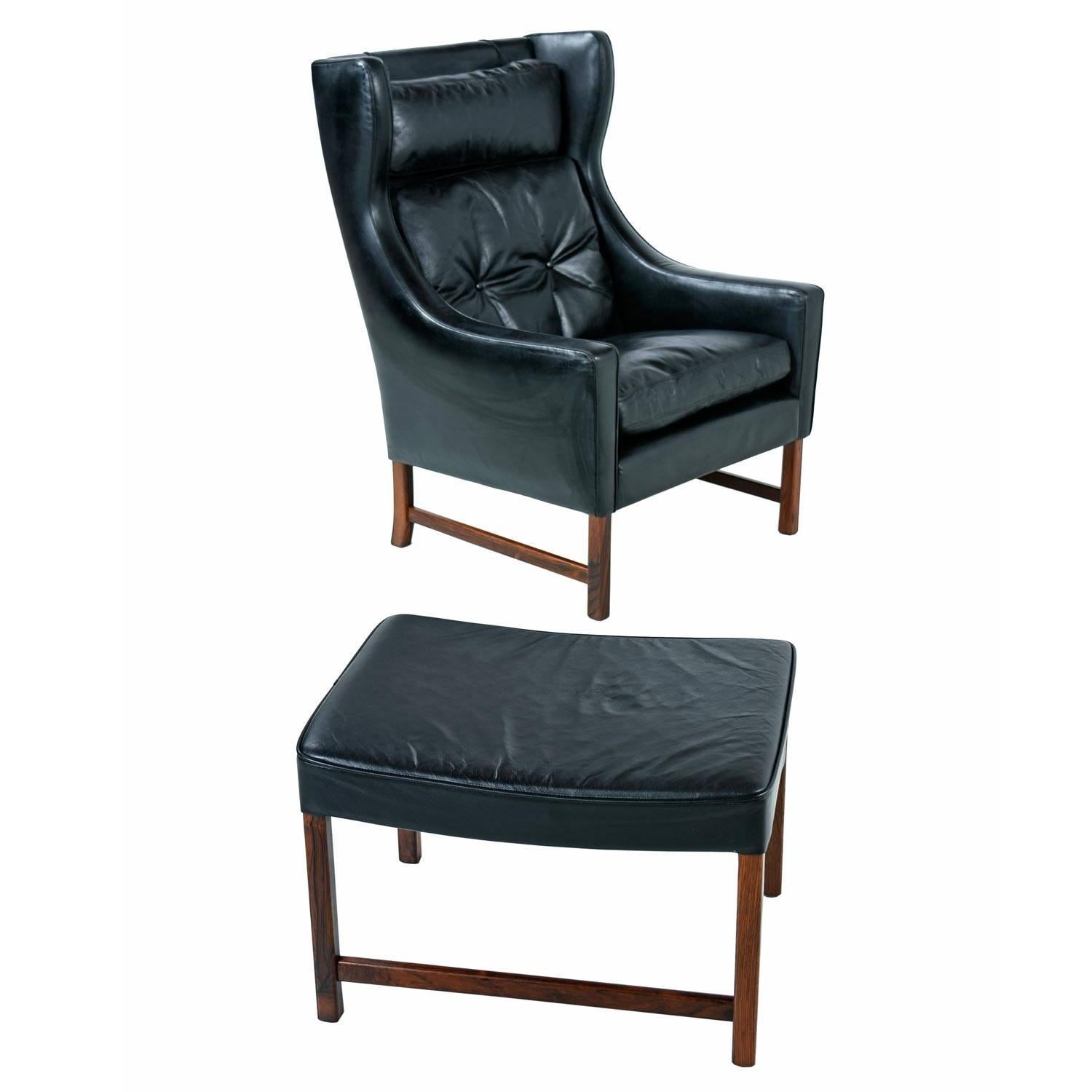 Fredrik Kayser Black Leather and Rosewood Wingback Lounge Chair and Ottoman In Excellent Condition In Chattanooga, TN