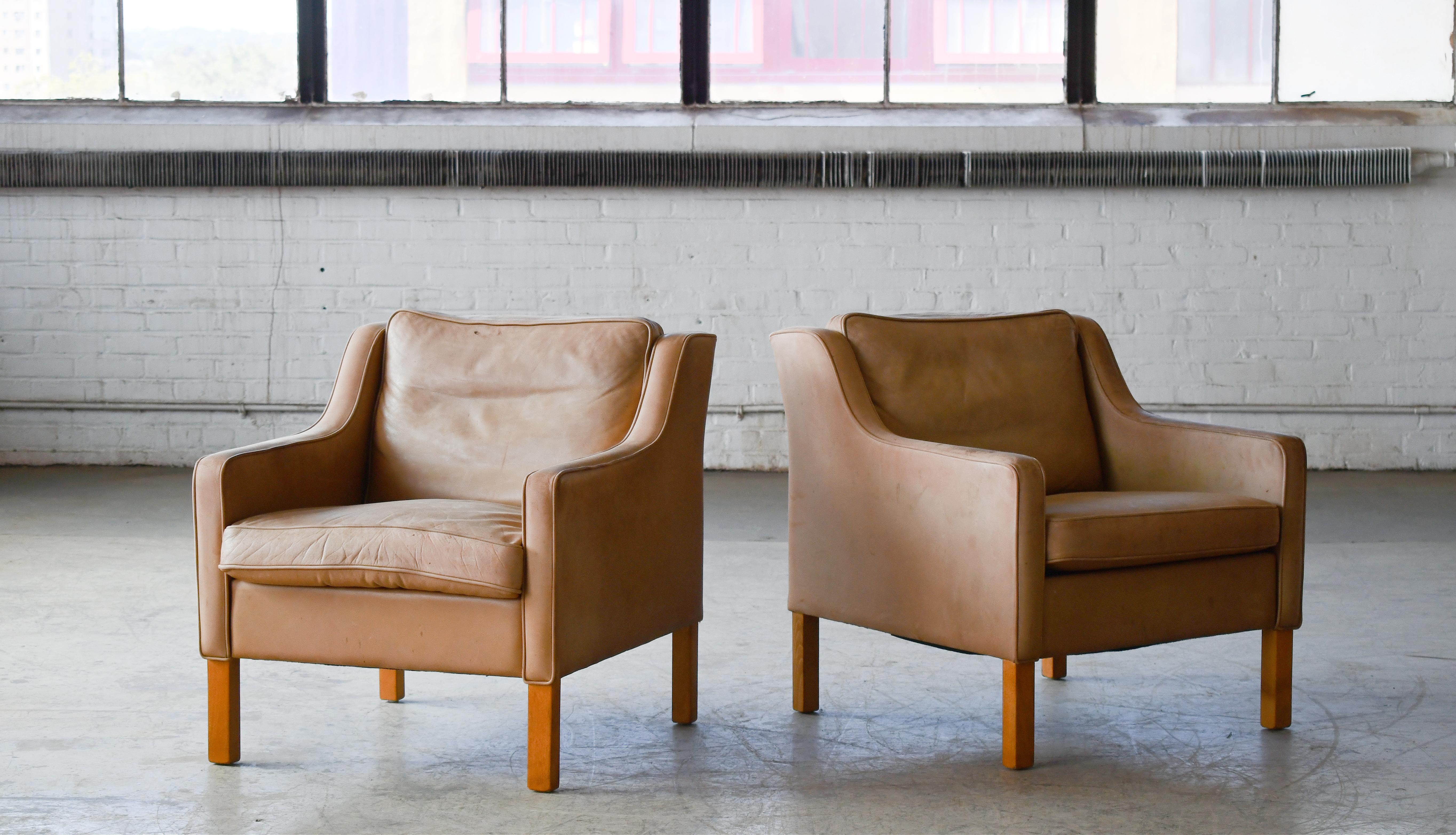 Stunning Børge Mogensen Style designed lounge chairs made in a supple natural vegetable tanned beige leather. Almost identical to Borge Mogensen's model 2321. One of the most elegant Classic midcentury Danish lounge chairs ever made of a design that