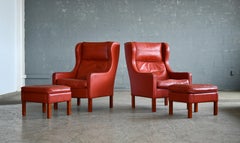 Børge Mogensen Style Pair of Wingback Lounge Chairs and Ottomans in Red Leather