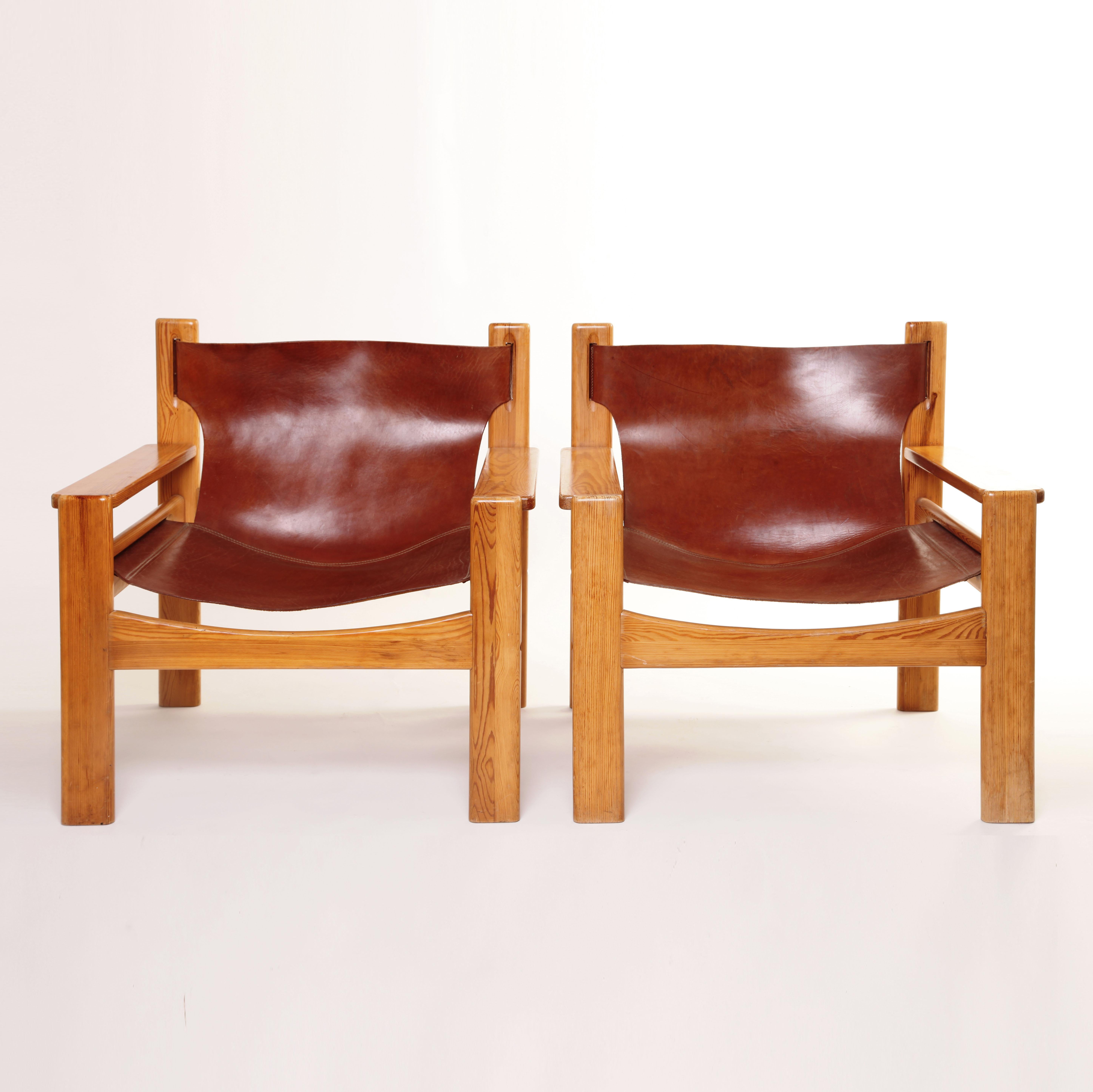 A unique pair of Børge Mogensen lounge armchairs. Sling Spanish style tan saddle leather on blond oak. Some wear, occasional scratches, fading or discoloration. for international shipping quotes please ask.
