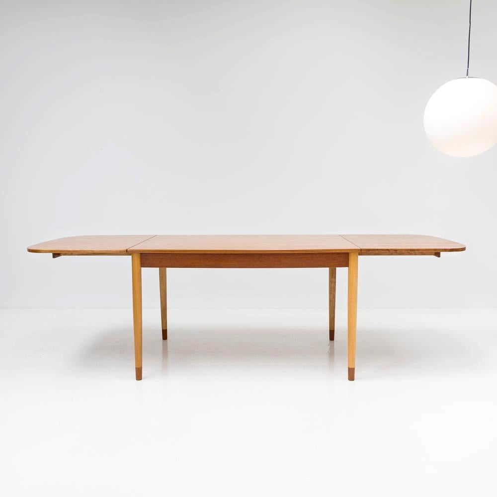 Borge Mogensen teak drop-leaf table for Søborg Møbelfabrik, Denmark, 1960s. Full size details: extended length with both leaves up 247 cm, folded length 125 cm, width 85cm, height 73.