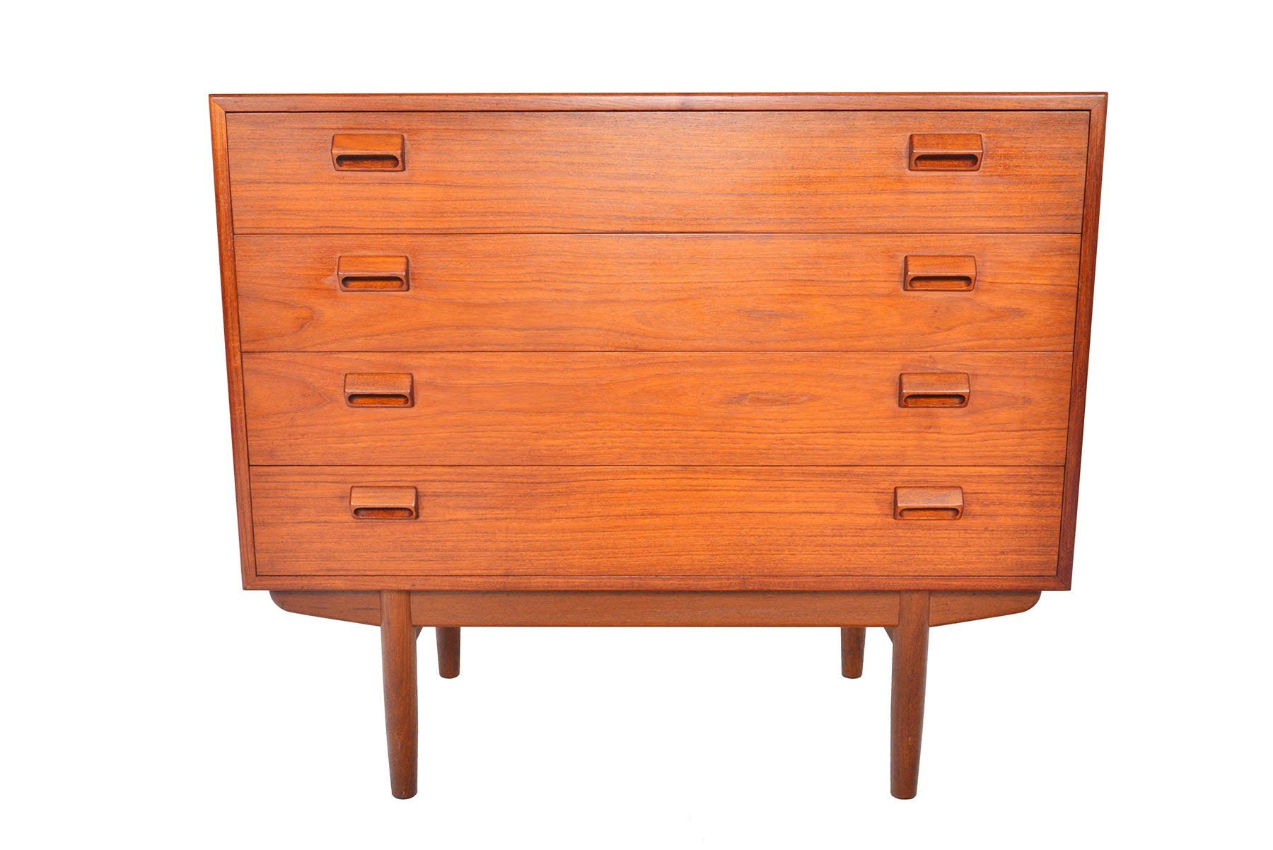 This beautiful gentleman’s chest was designed by Børge Mogensen for Søborg Møbelfabrik in 1951. The case is expertly crafted in teak and stands on a solid teak base. Each drawer front is adorned with the designer’s signature handles. Four deep