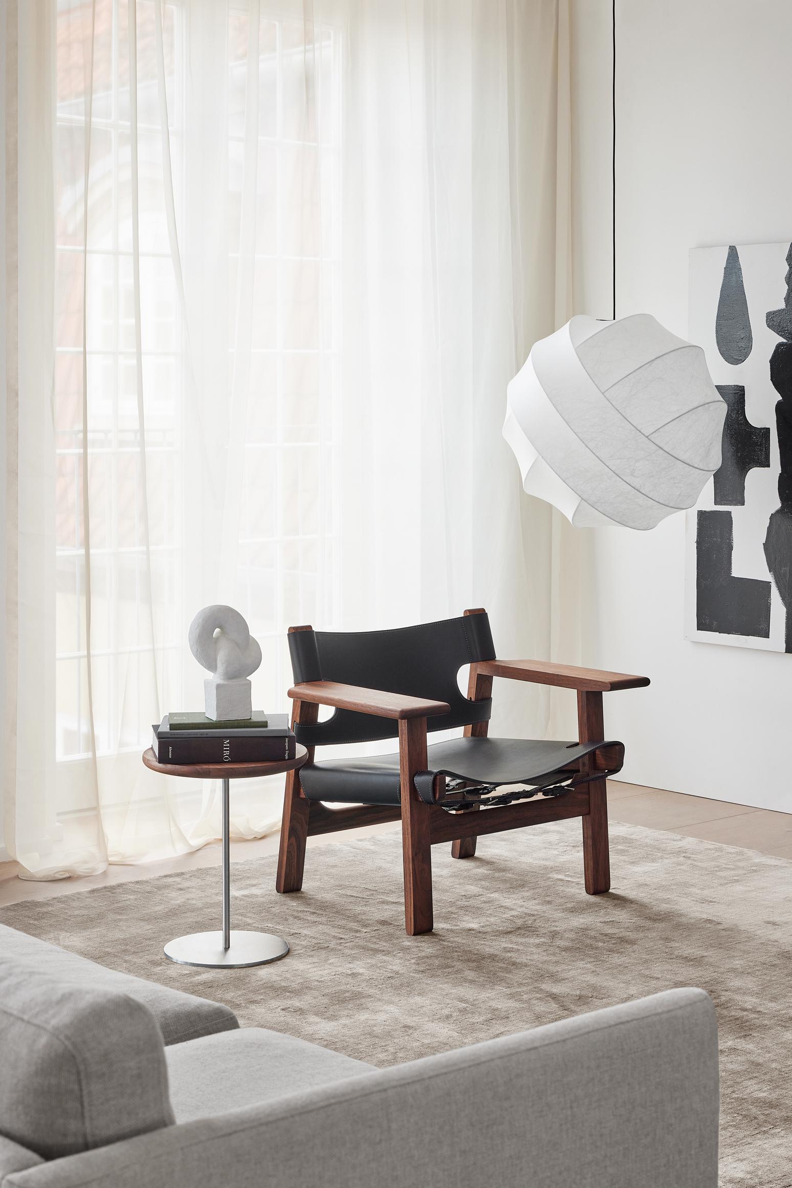 The iconic Spanish Chair is Børge Mogensen’s masterful contribution to modern design, designed for Fredericia in 1958. Solid oak or walnut combined with the highest caliber saddle leather creates a strong presence in a chair that will only become