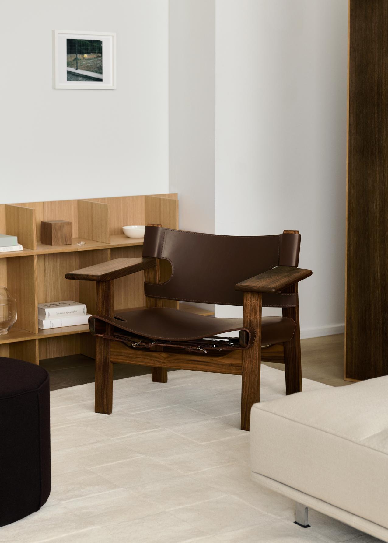 The iconic Spanish Chair is Børge Mogensen’s masterful contribution to modern design, designed for Fredericia in 1958. Solid oak or walnut combined with the highest caliber saddle leather creates a strong presence in a chair that will only become