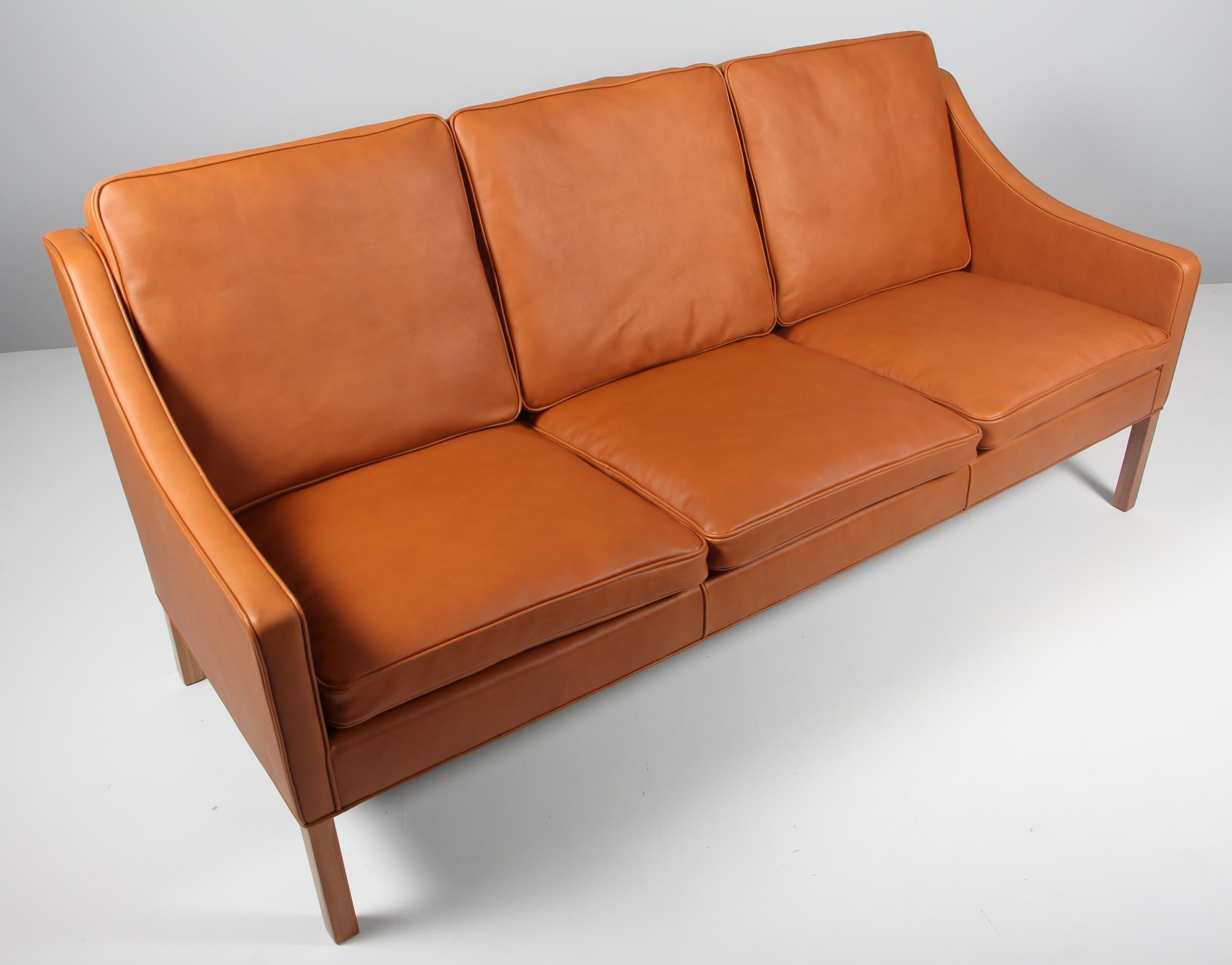 Børge Mogensen three-seat sofa new upholstery with walnut elegance aniline leather.

Legs of walnut.

Model 2209, made by Fredericia furniture.