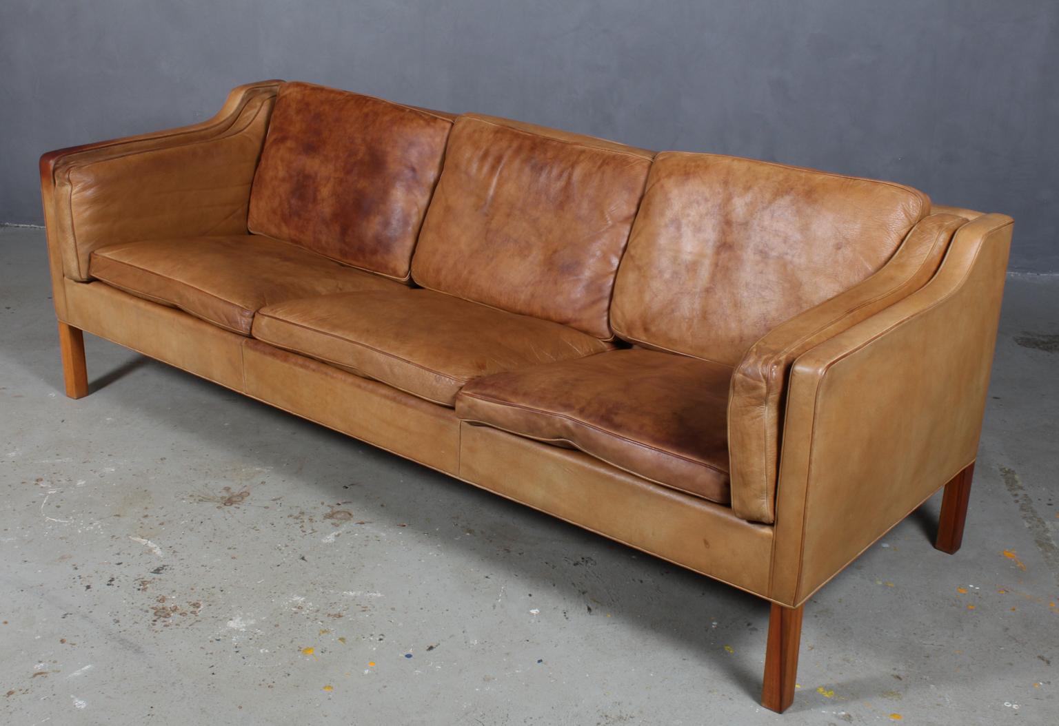 Børge Mogensen three-seat sofa with original patinated nature upholstery.

Legs of mahogany.

Model 2213, made by Fredericia Furniture.