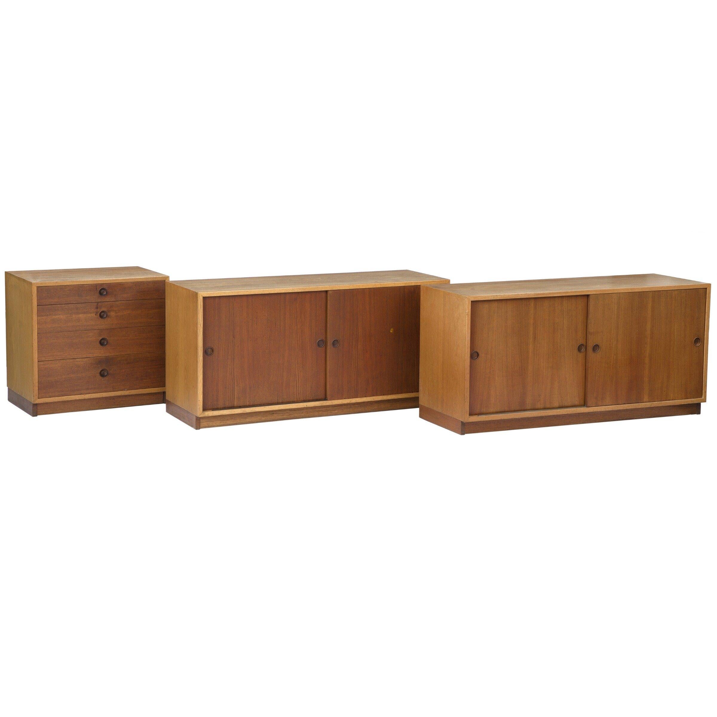 Description: Set of three- two cabinets and one chest of drawers of oak with Sliding doors and drawer fronts of teak. Manufactured by Karl Andersson & Söner.

Designer: Børge Mogensen

Cabinets dimensions: 53 W x 18 D x 26 H

Chest of drawers