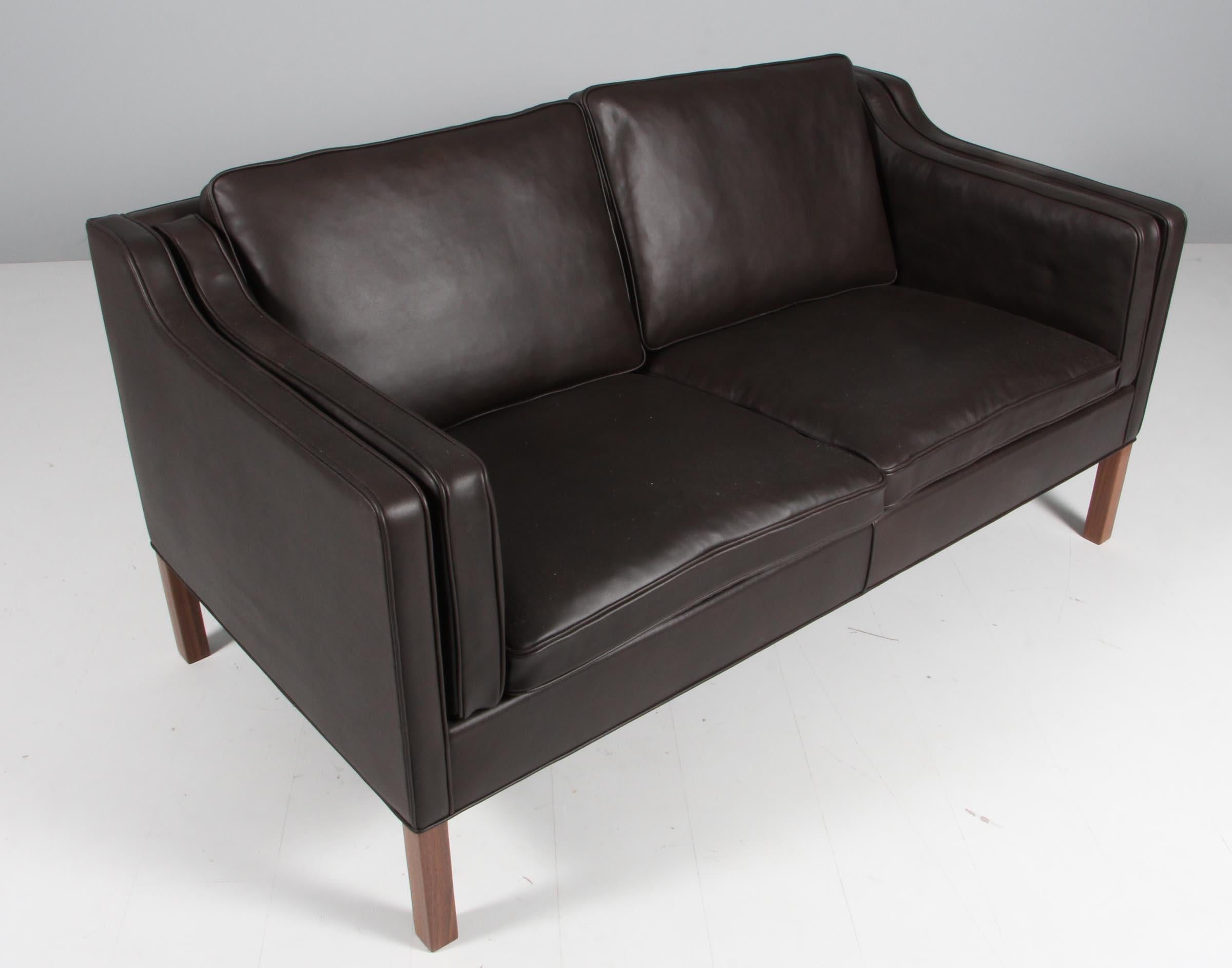 Børge Mogensen two-seat sofa new upholstered with mokka elegance aniline leather.

Legs of mahogany.

Model 2212, made by Fredericia Furniture.