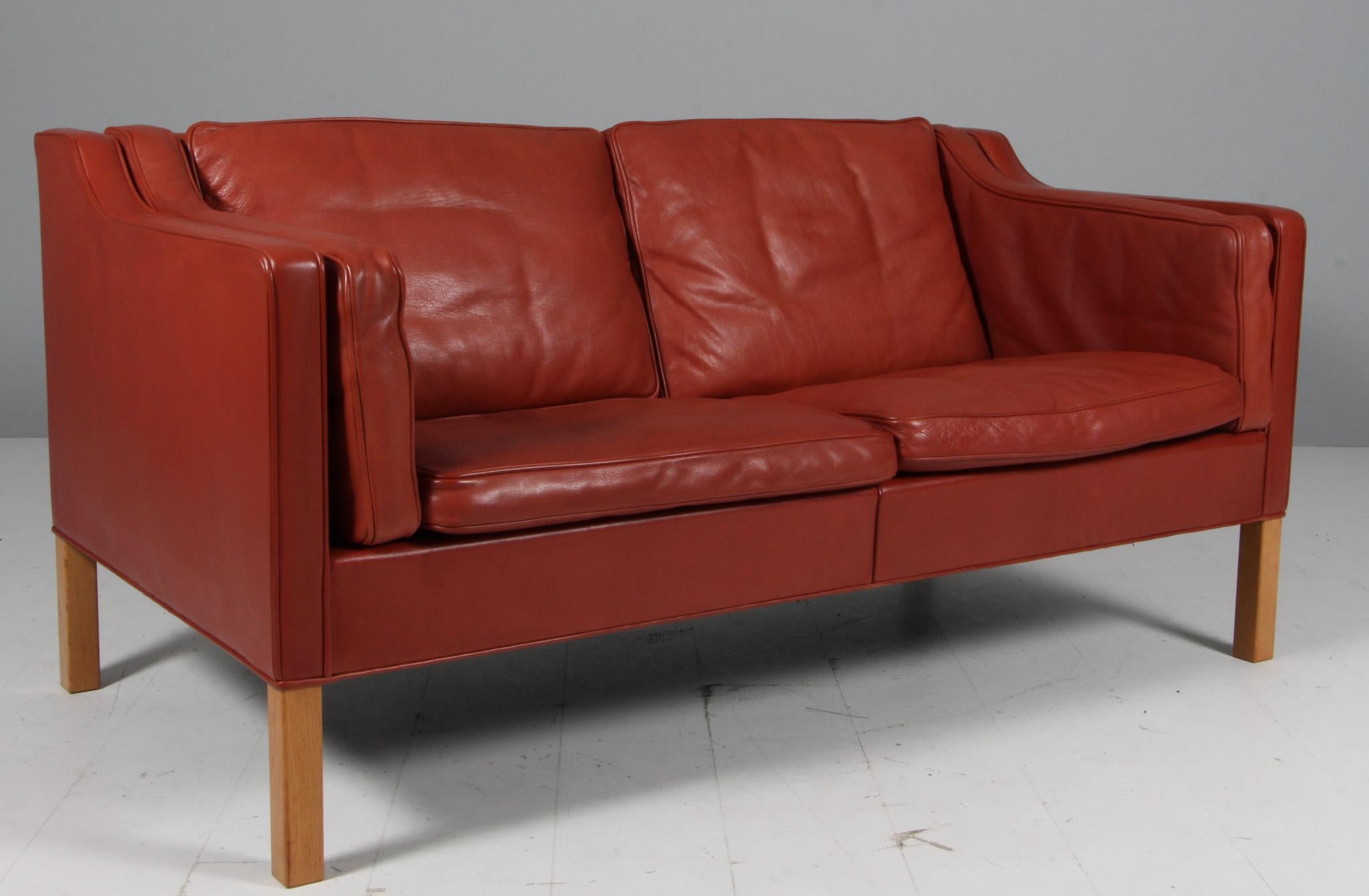 Børge Mogensen two-seat sofa with original leather upholstery.

Legs of oak.

Model 2212, made by Fredericia Furniture.

